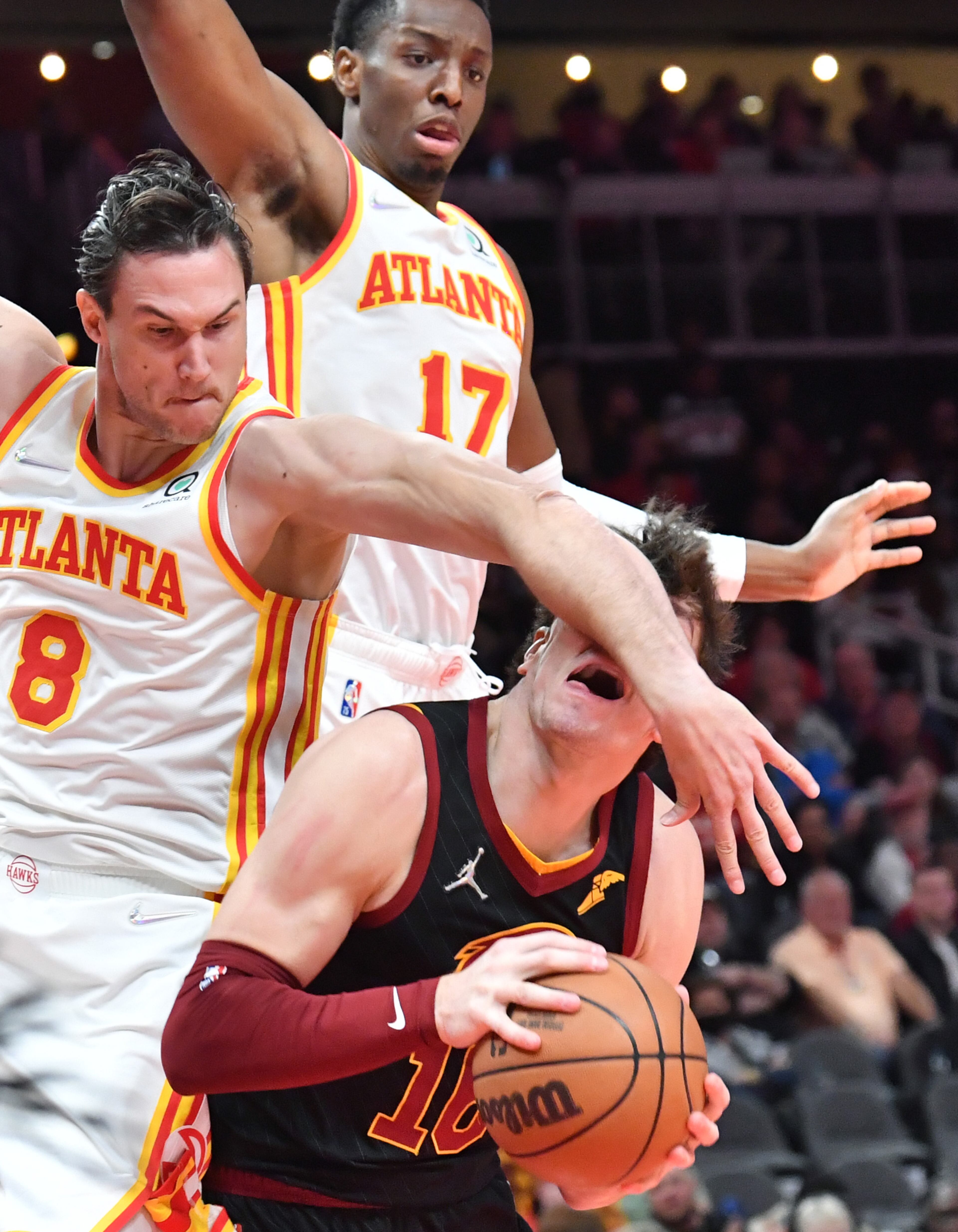 Cleveland Cavaliers' forward Cedi Osman (16) is fouled by Atlanta Hawks' forward Danilo Gallinari (8) as he prepares to shoot during the second half in an NBA basketball game at State Farm Arena on Thursday, March 31, 2022. Atlanta Hawks won 131-107 over Cleveland Cavaliers. (Hyosub Shin / Hyosub.Shin@ajc.com)