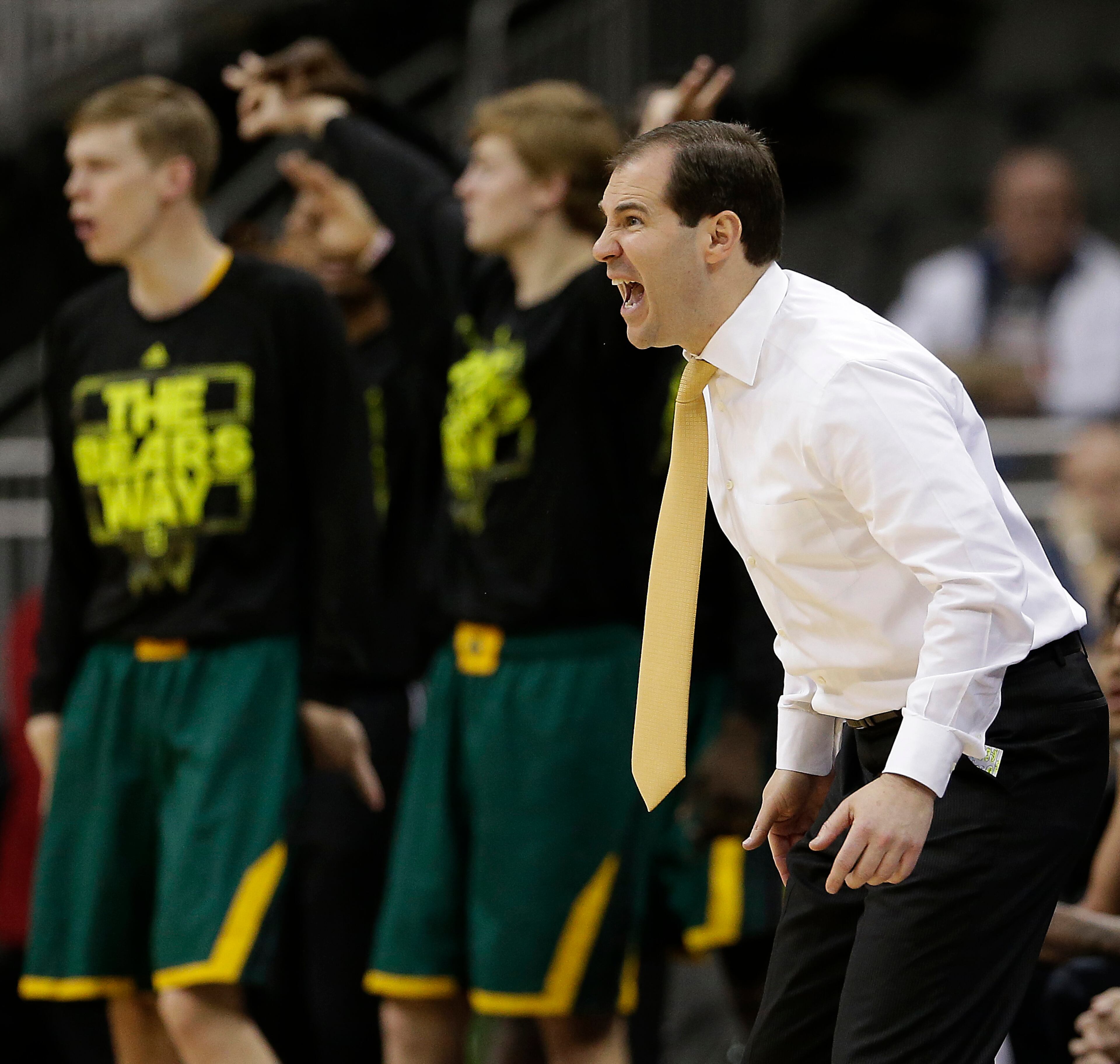 Baylor coach Scott Drew instructs his players during the first half of an NCAA college basketball game against the Texas in the semifinals of the Big 12 Conference tournament on Friday, March 14, 2014, in Kansas City, Mo.
