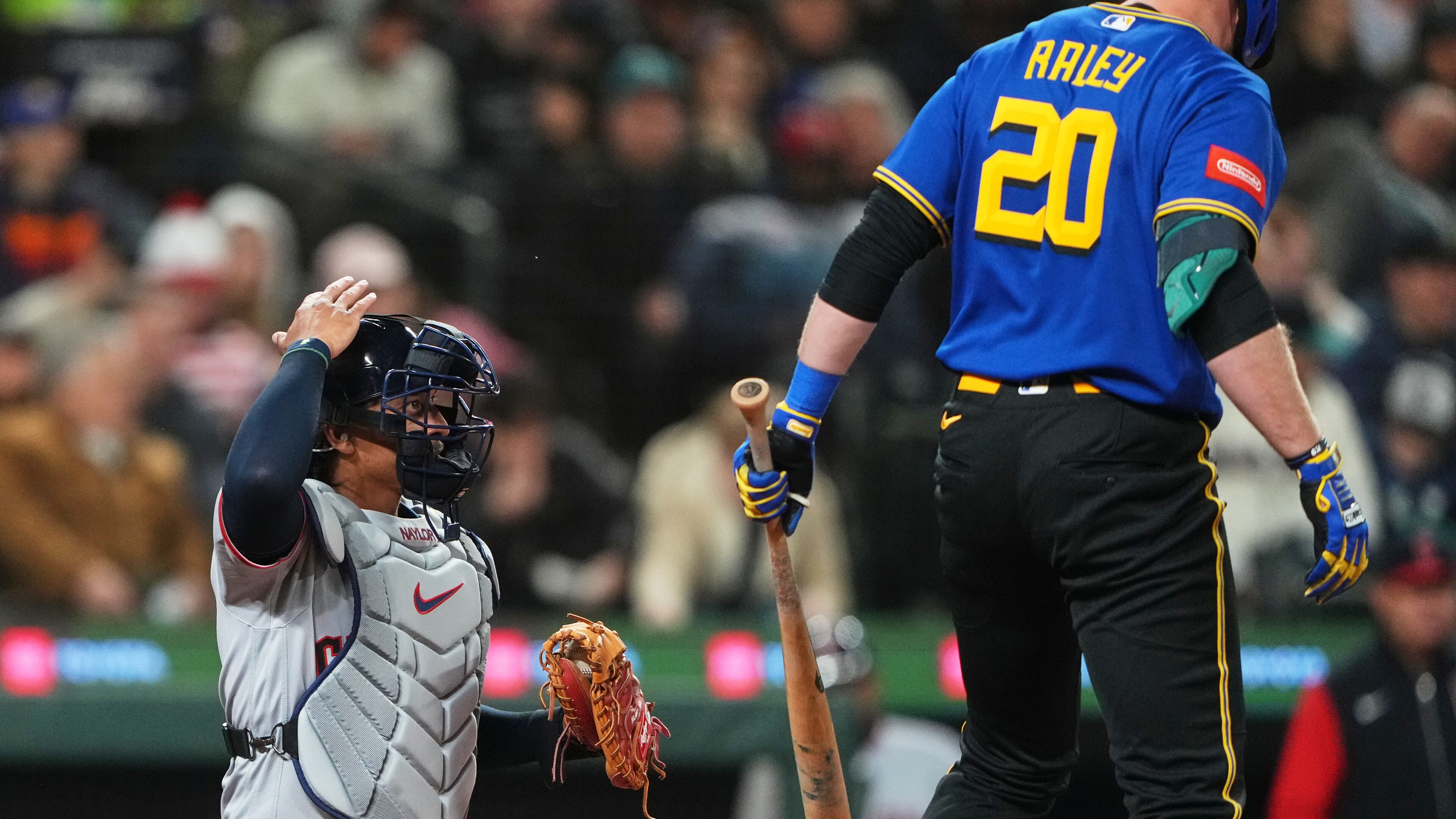FILE - Cleveland Guardians catcher Bo Naylor challenges a call during an at-bat by Seattle Mariners' Luke Raley during the fourth inning of a baseball game, Friday, March 27, 2026, in Seattle. (AP Photo/Lindsey Wasson, filr)