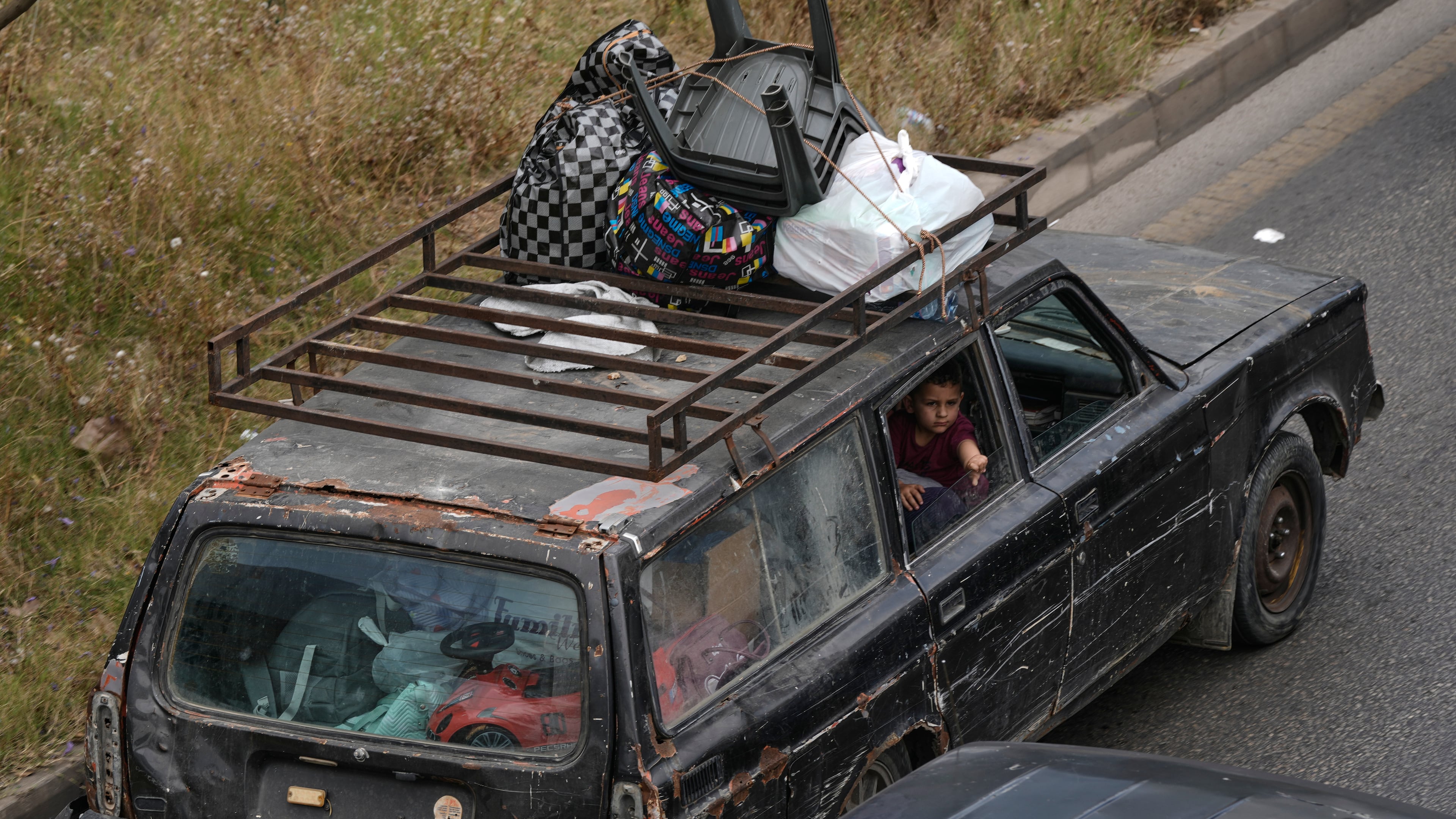 A family flees following an Israeli threat to strike Dahiyeh, Beirut's southern suburbs, Lebanon, Monday, June 1, 2026. (AP Photo/Bilal Hussein)