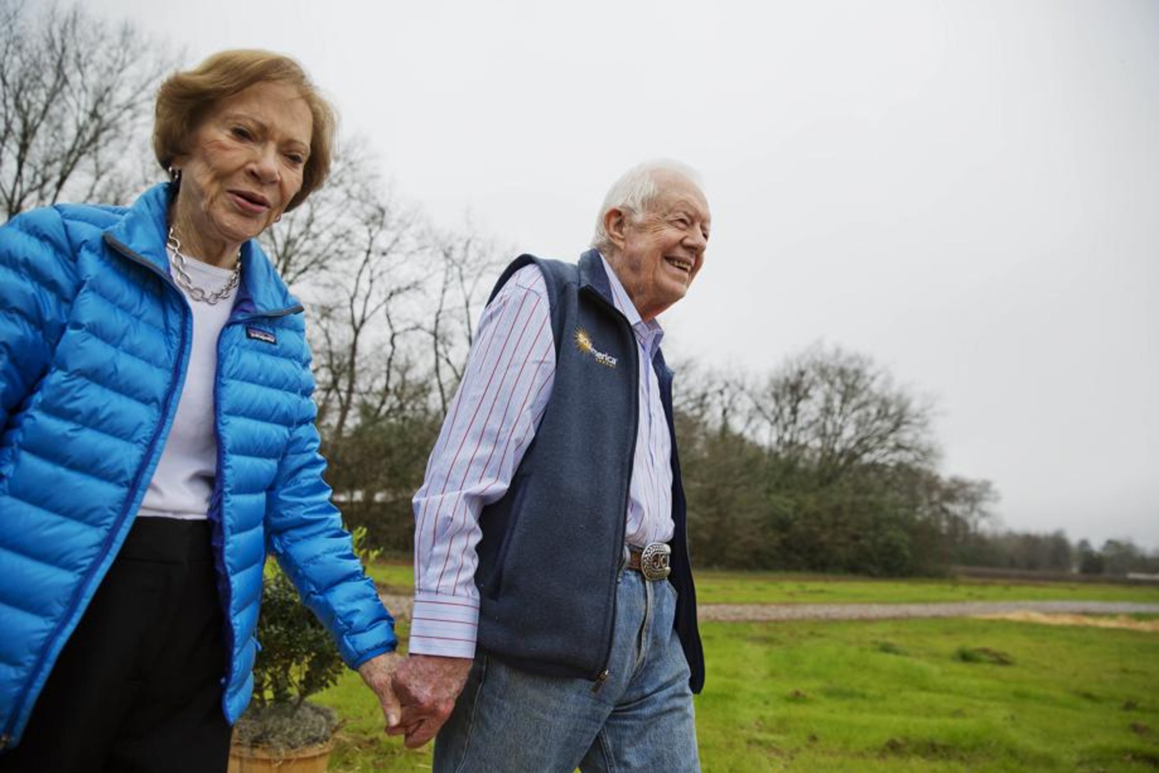 Former President Jimmy Carter, right, and his wife Rosalynn arrive for a ribbon cutting ceremony for a solar panel project on farmland he owns in their hometown of Plains, Ga., Wednesday, Feb. 8, 2017. (AP Photo/David Goldman)