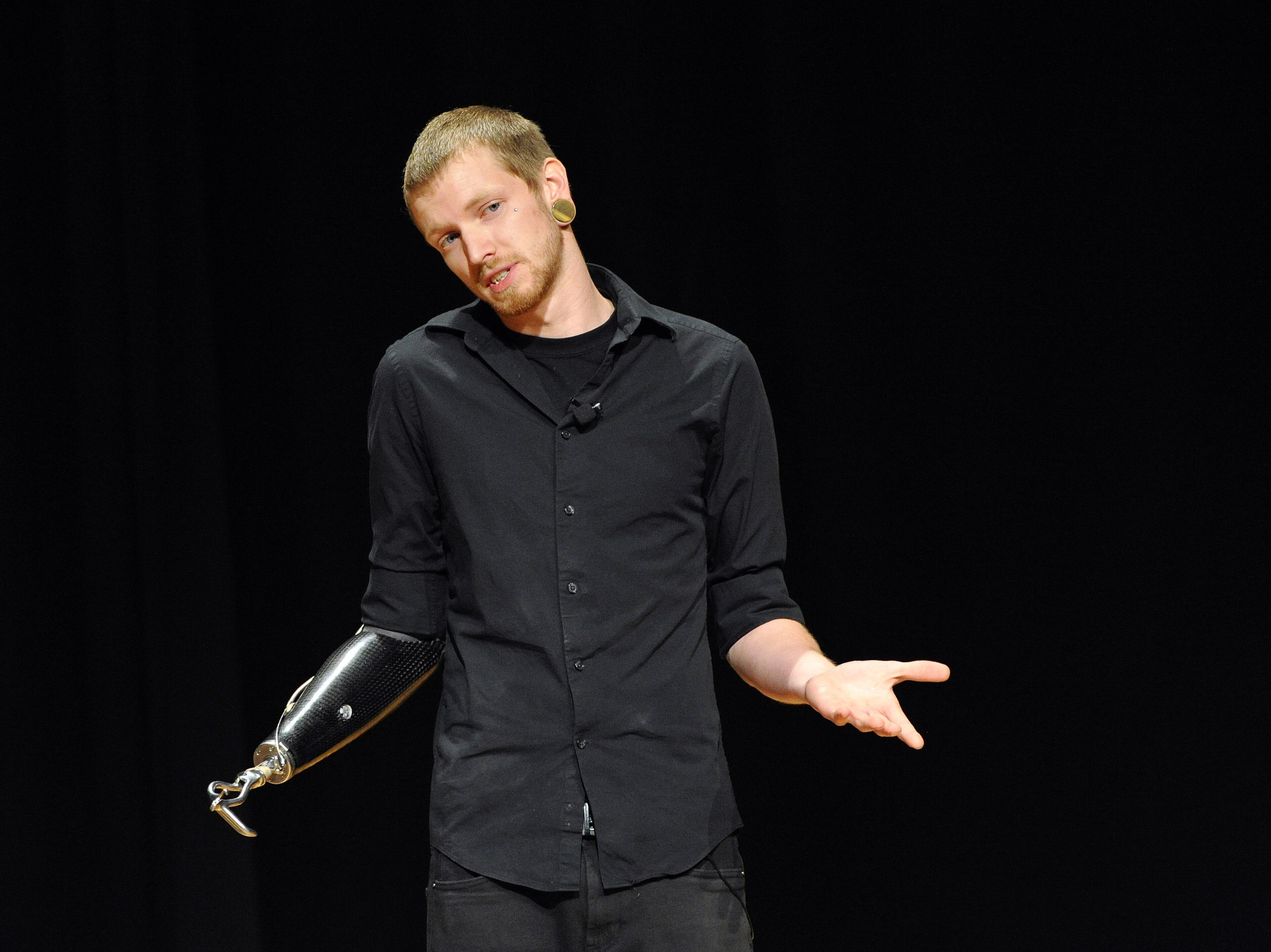 Jason Barnes, a drummer who lost his right hand in an accident, tells his personal story during a Kennesaw State University concert on Saturday March 21, 2014 in Kennesaw, Ga. David Tulis / AJC Special