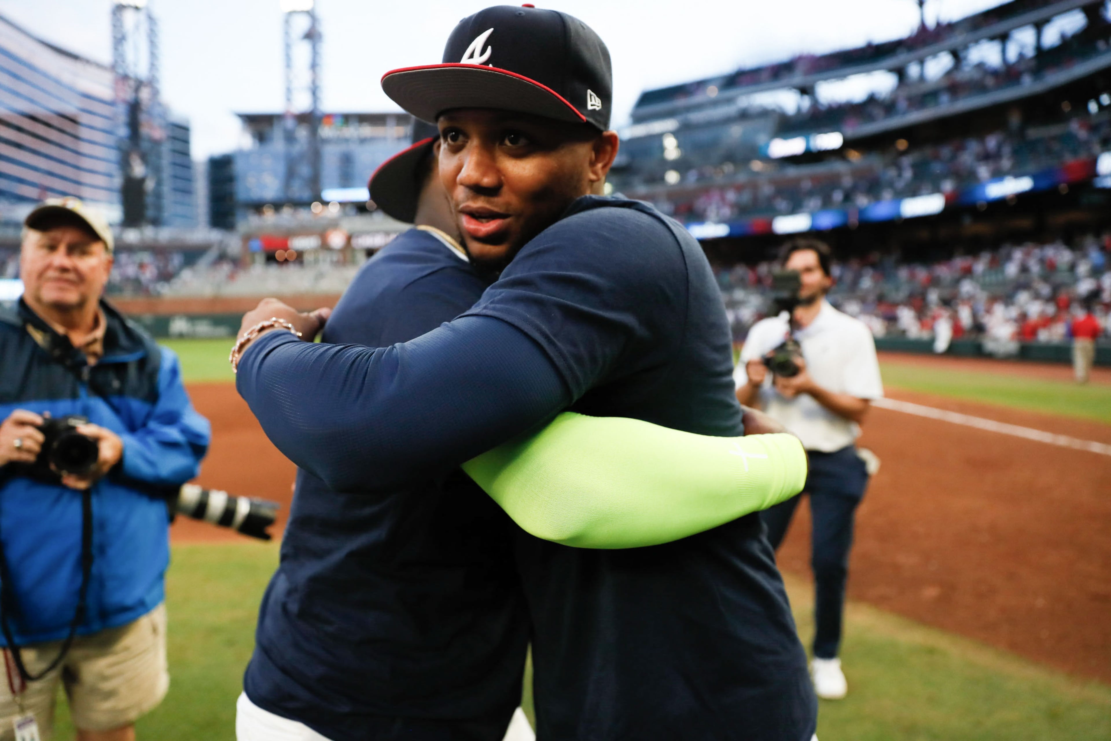 Braves outfielder Ronald Acuña Jr. hugs designated hitter Marcell Ozuna after a 3-0 win.
(Miguel Martinez/ AJC)