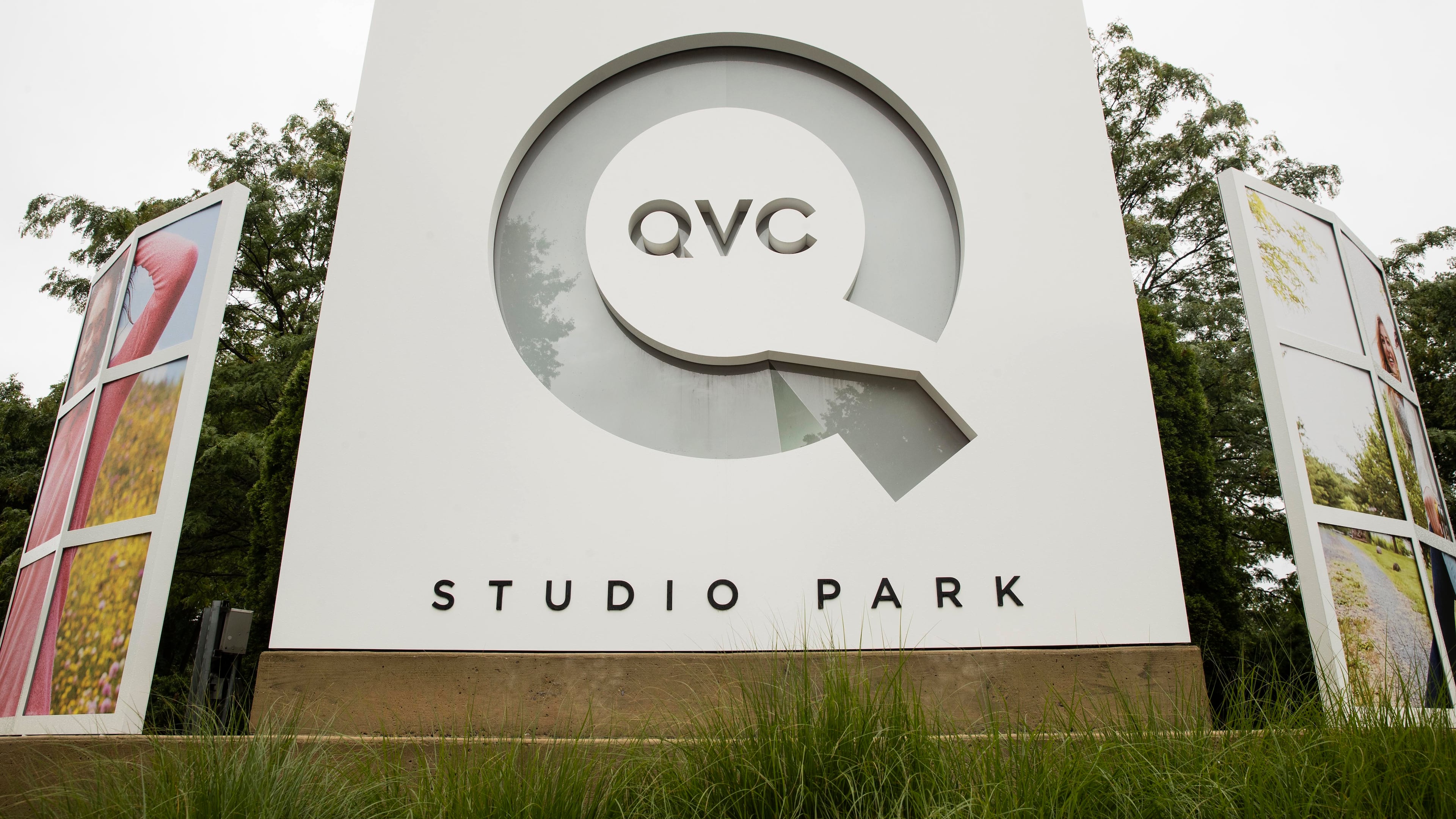 FILE - Corporate signage is shown outside a QVC facility in West Chester, Pa., Friday, July 7, 2017. (AP Photo/Matt Rourke, File)