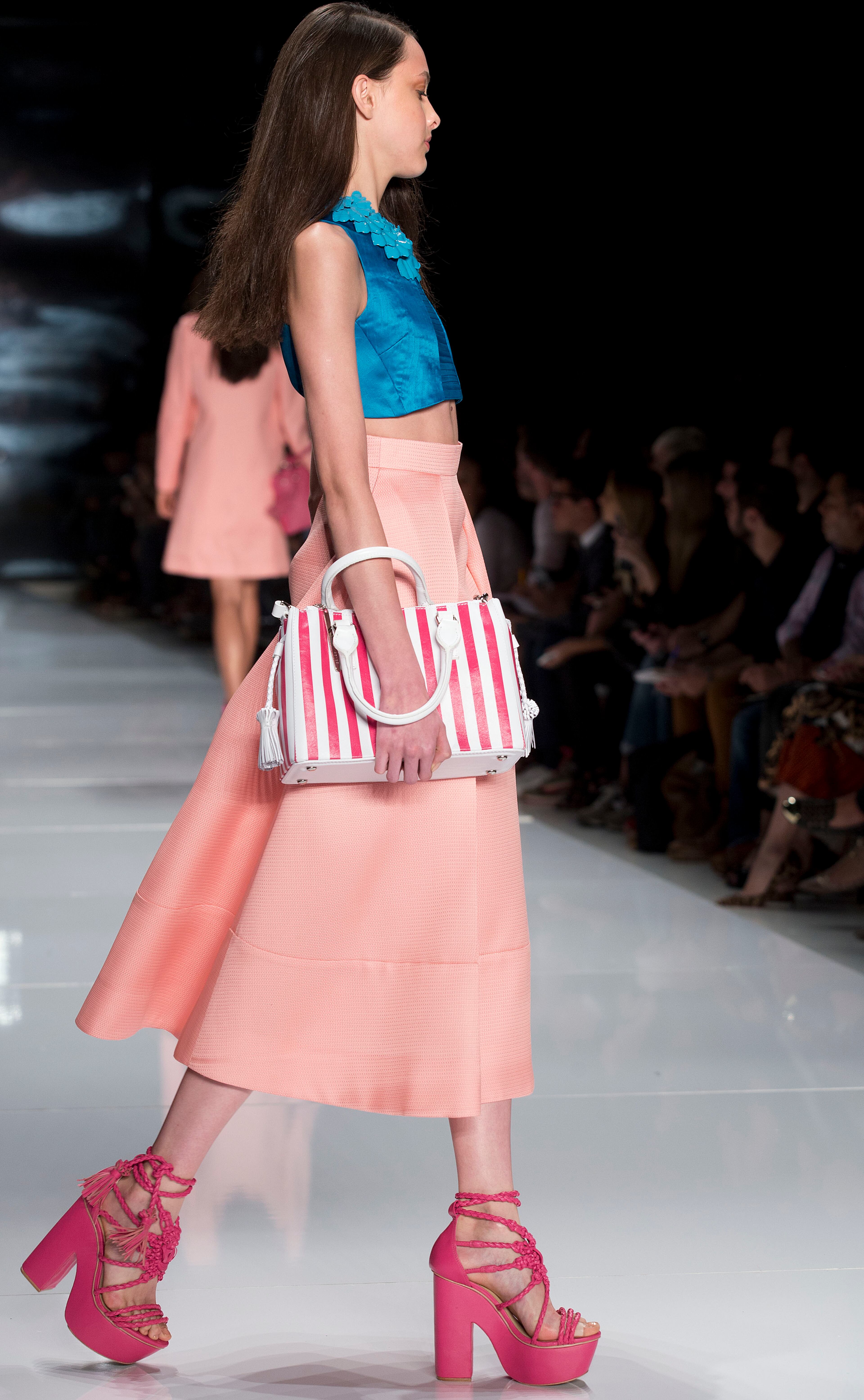 A model wears a creation from the Colcci Summer collection during Sao Paulo Fashion Week in Sao Paulo, Brazil, Wednesday, April 2, 2014.