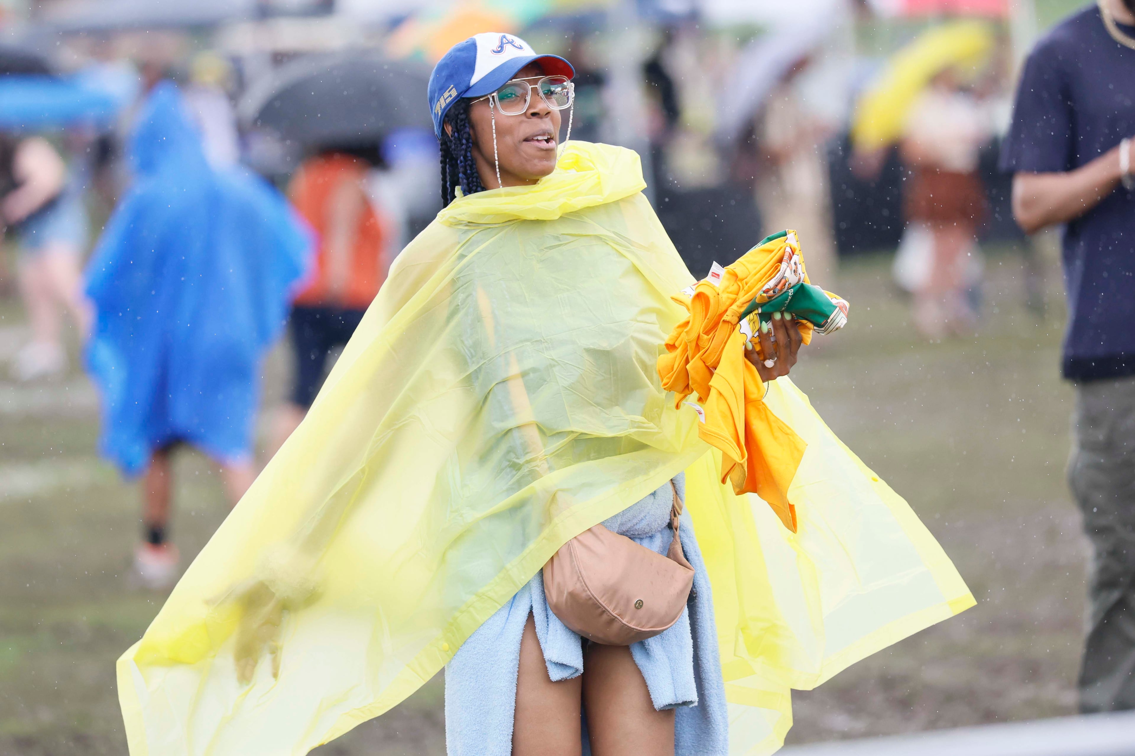 A woman dances as rain starts falling during the Atlanta Jazz Festival at Piedmont Park on Sunday, May 24, 2026, in Midtown Atlanta.
(Miguel Martinez/AJC)