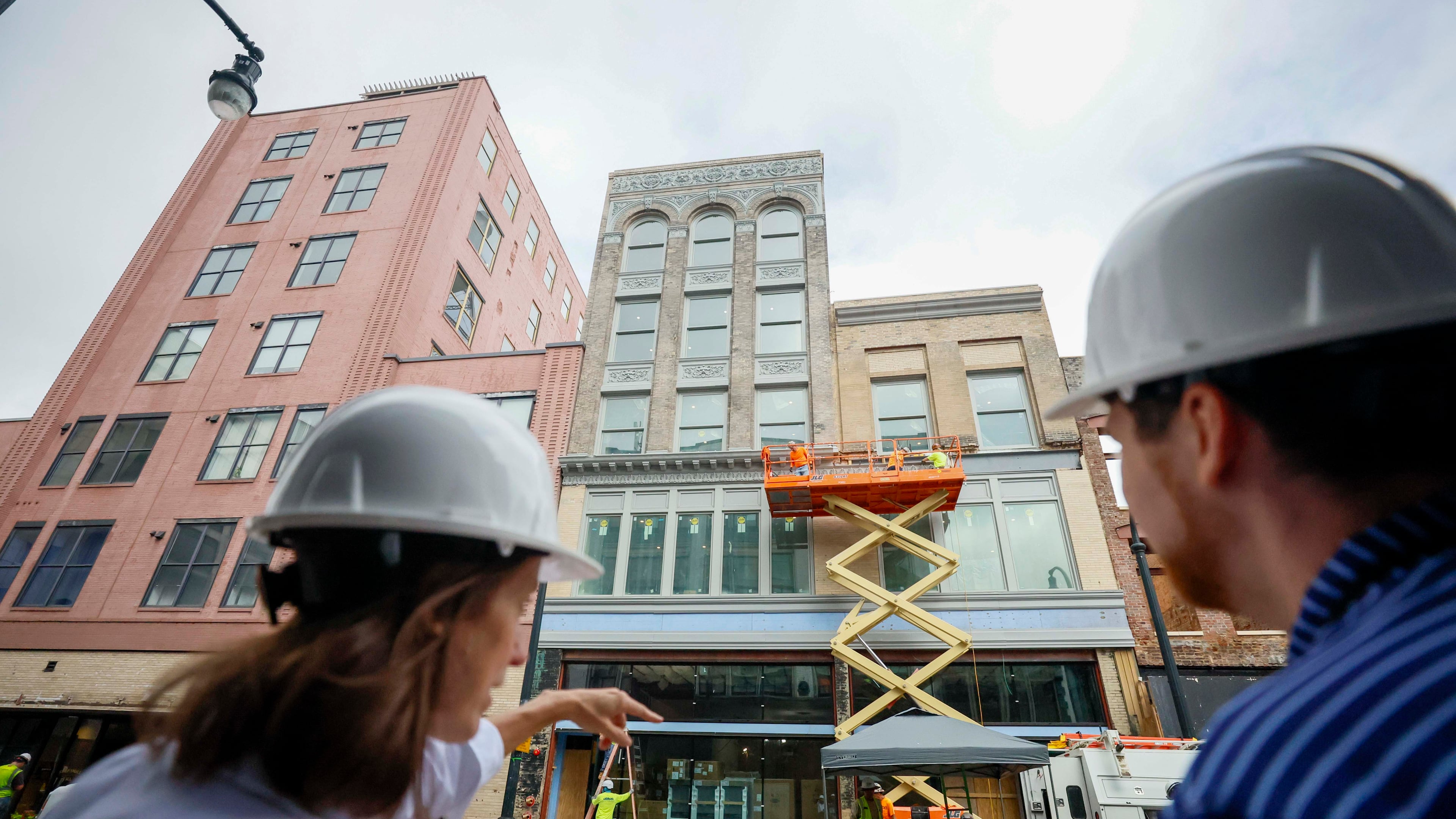 April Stammel, left, who leads marketing and community engagement with South Downtown, discusses the progress of work being done at 85 Peachtree during a tour of the area on Wednesday, May 27, 2026. Over 50 historic buildings are being restored to create retail and residential spaces in one of Atlanta’s most ambitious downtown projects. (Miguel Martinez/AJC)