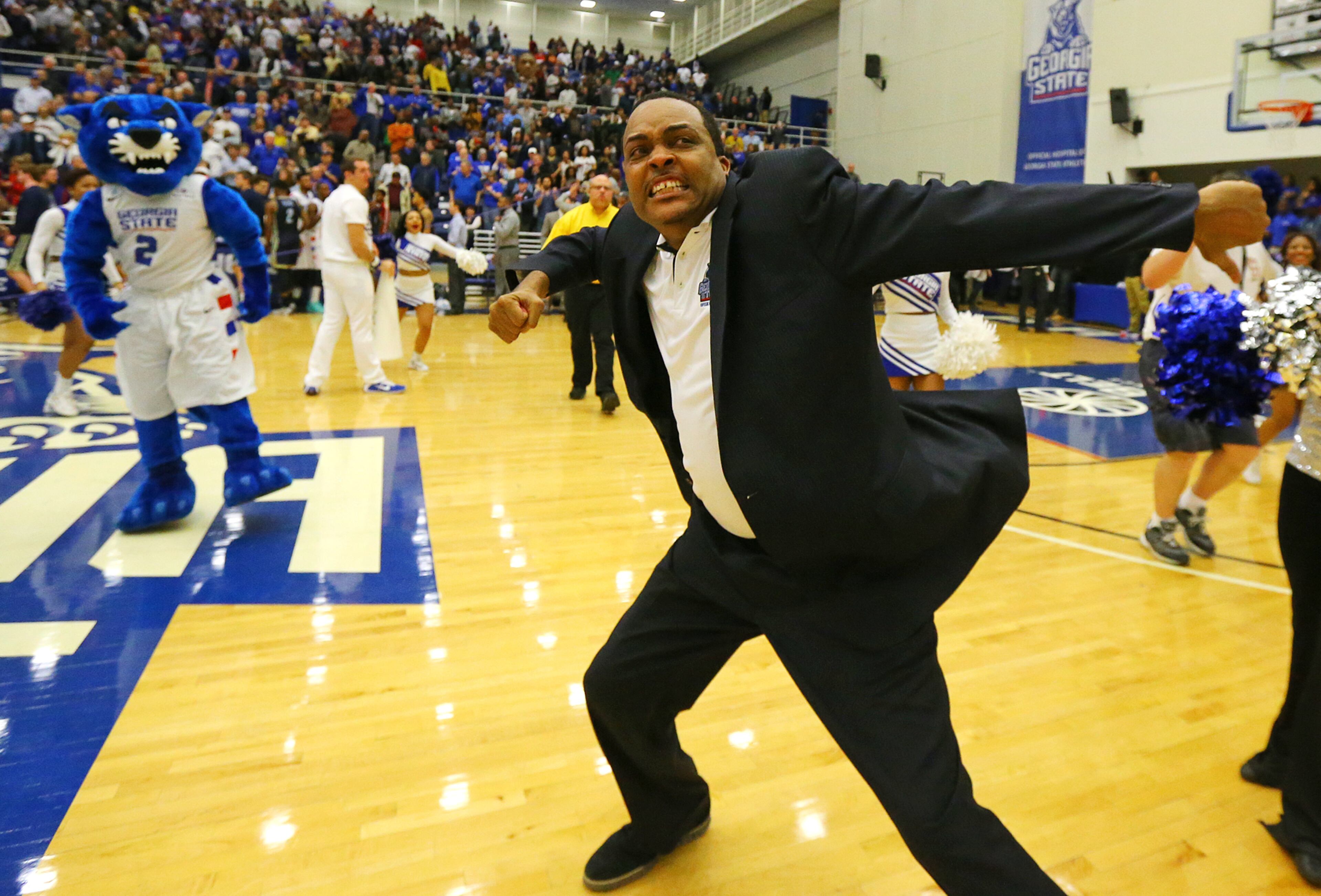 Georgia State head coach Ron Hunter reacts to winning the Sun Belt men's basketball regular season championship charging the fans after beating Georgia Southern 72-55 in a basketball game on Saturday, March 7, 2015, in Atlanta.