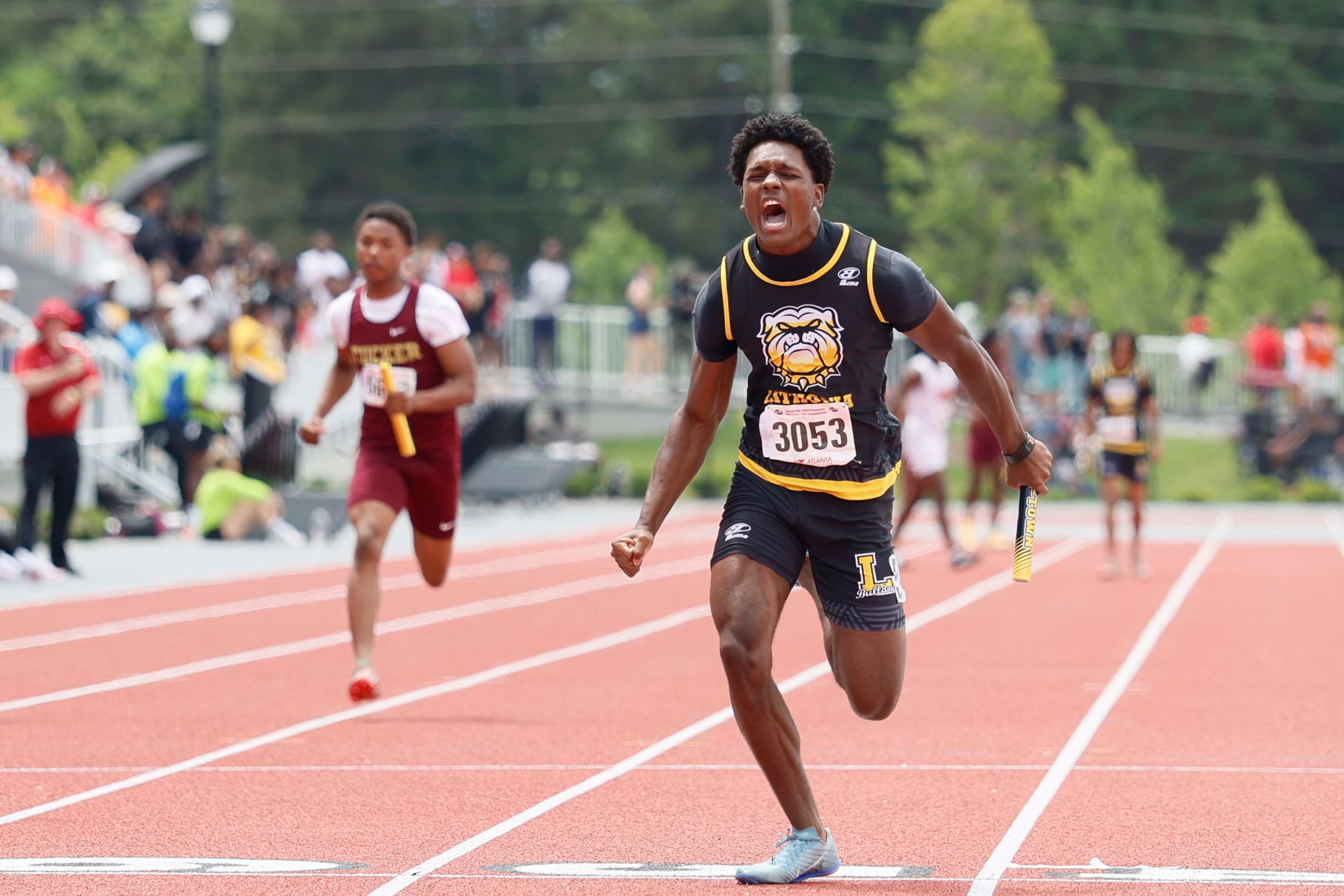 A runner from Lithonia High School reacts after crossing the finish line, helping his team win the Boys 4x100 Meter Relay AAAA during the GHSA track and field state championship at UGA Spec Towns Track on Monday, May 11, 2026, in Athens.
(Miguel Martinez/AJC)