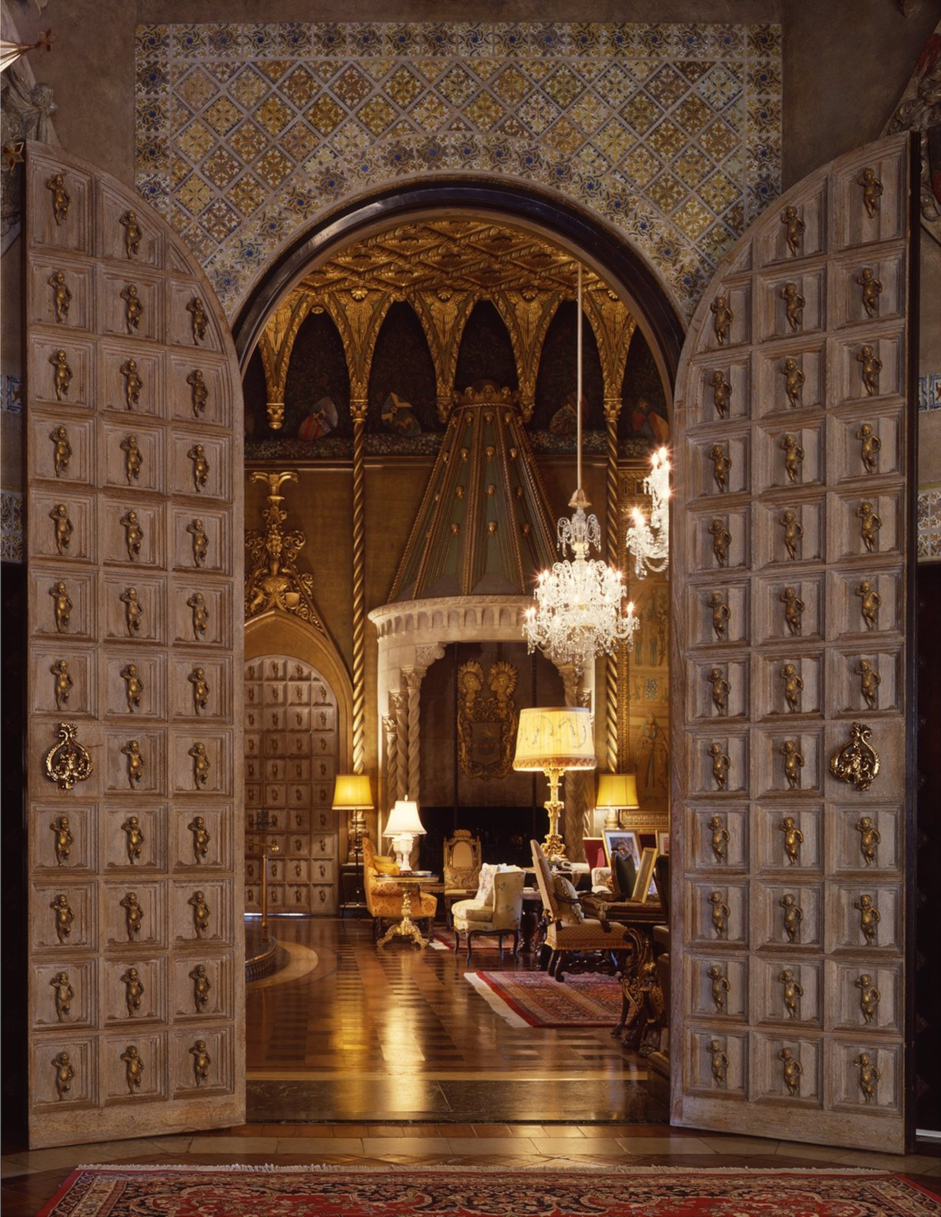 Visitors to Mar-a-Lago, then and now, enter the living room through massive carved doors set with putti (cherub) figures. The black and white marble floors came from a Cuban castle. 1993 photo/C.J. Walker