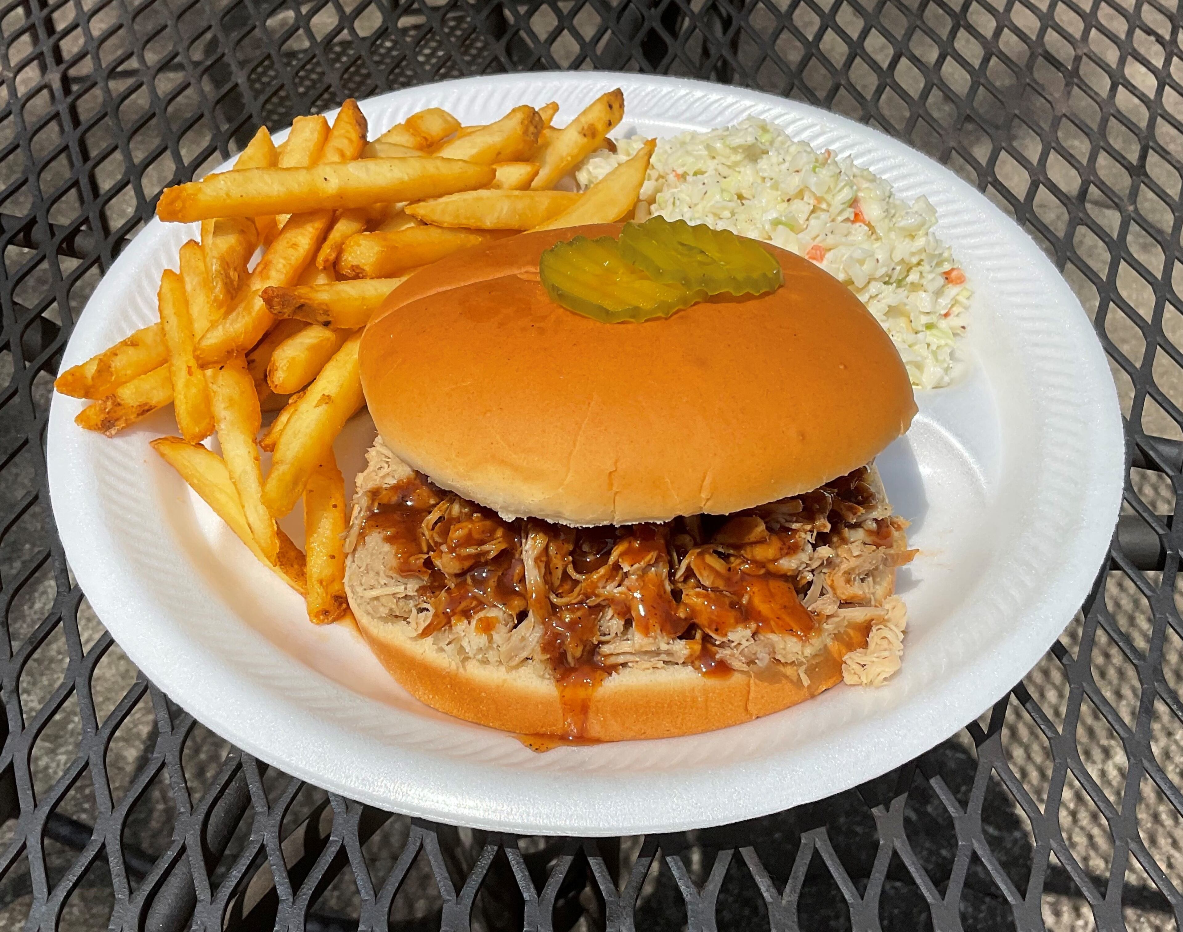 At McDaniel’s QN2, you can get a pulled pork sandwich with french fries and coleslaw. Courtesy of McDaniel’s QN2