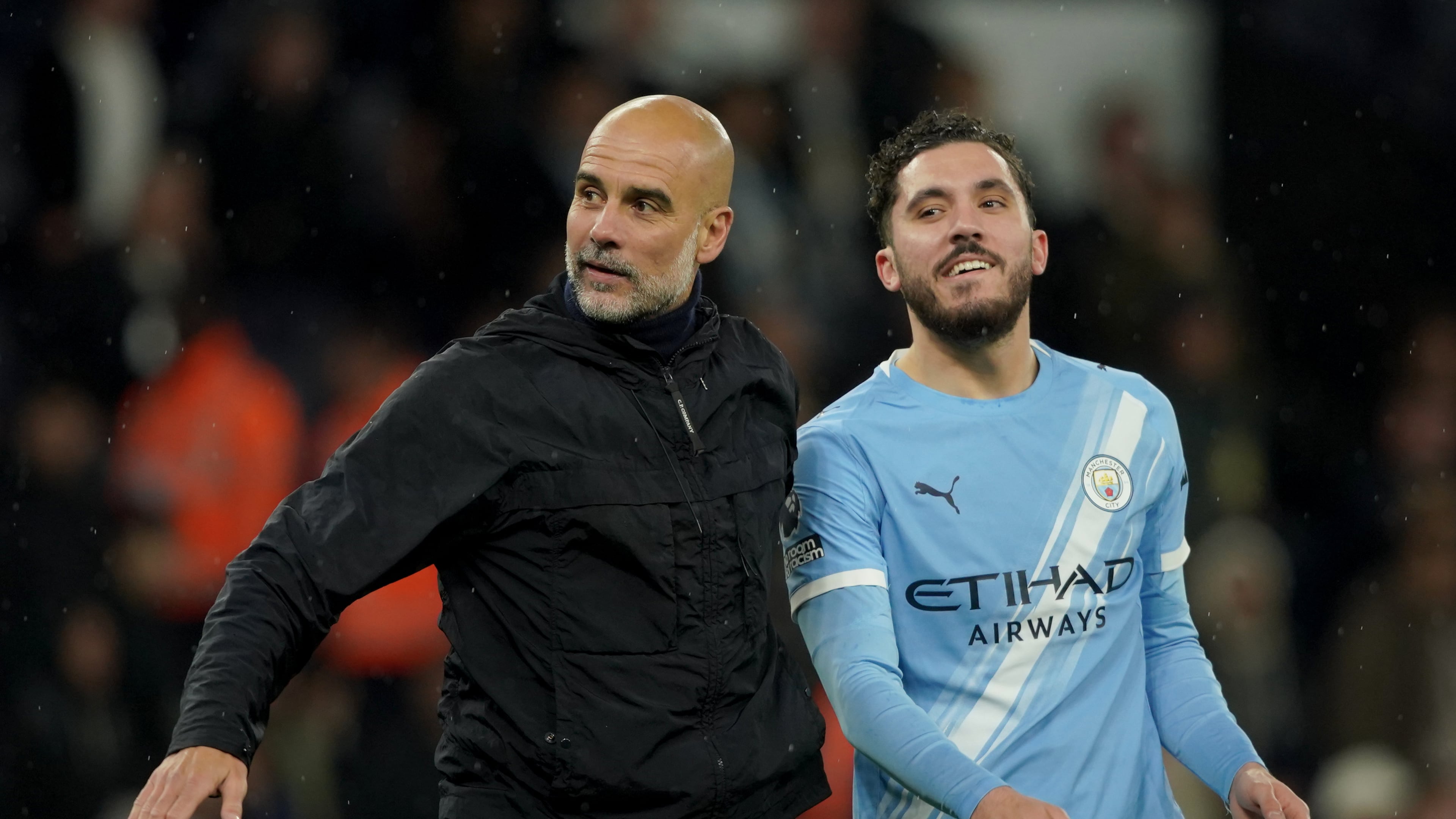 Manchester City's head coach Pep Guardiola, left, celebrates with Manchester City's Rayan Cherki at the end of the English Premier League soccer match between Manchester City and Crystal Palace in Manchester, England, Wednesday, May 13, 2026. (AP Photo/Ian Hodgson)