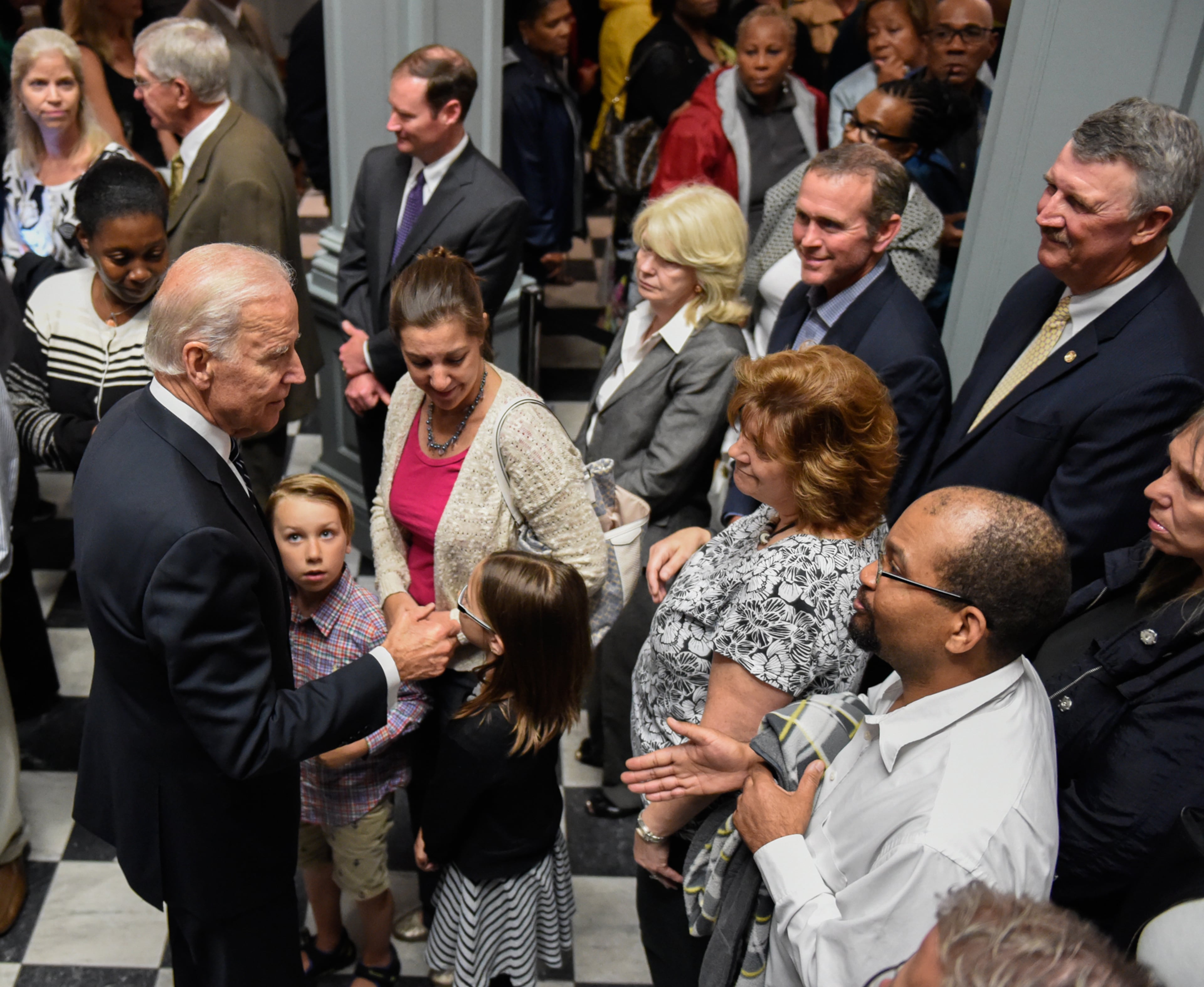 Vice President Joe Biden greets people waiting in line for the viewing of his son, former Delaware Attorney General Beau Biden, Thursday, June 4, 2015, at Legislative Hall in Dover, Del. Beau Biden died of brain cancer Saturday at age 46. (Jason Minto/The Wilmington News-Journal via AP)