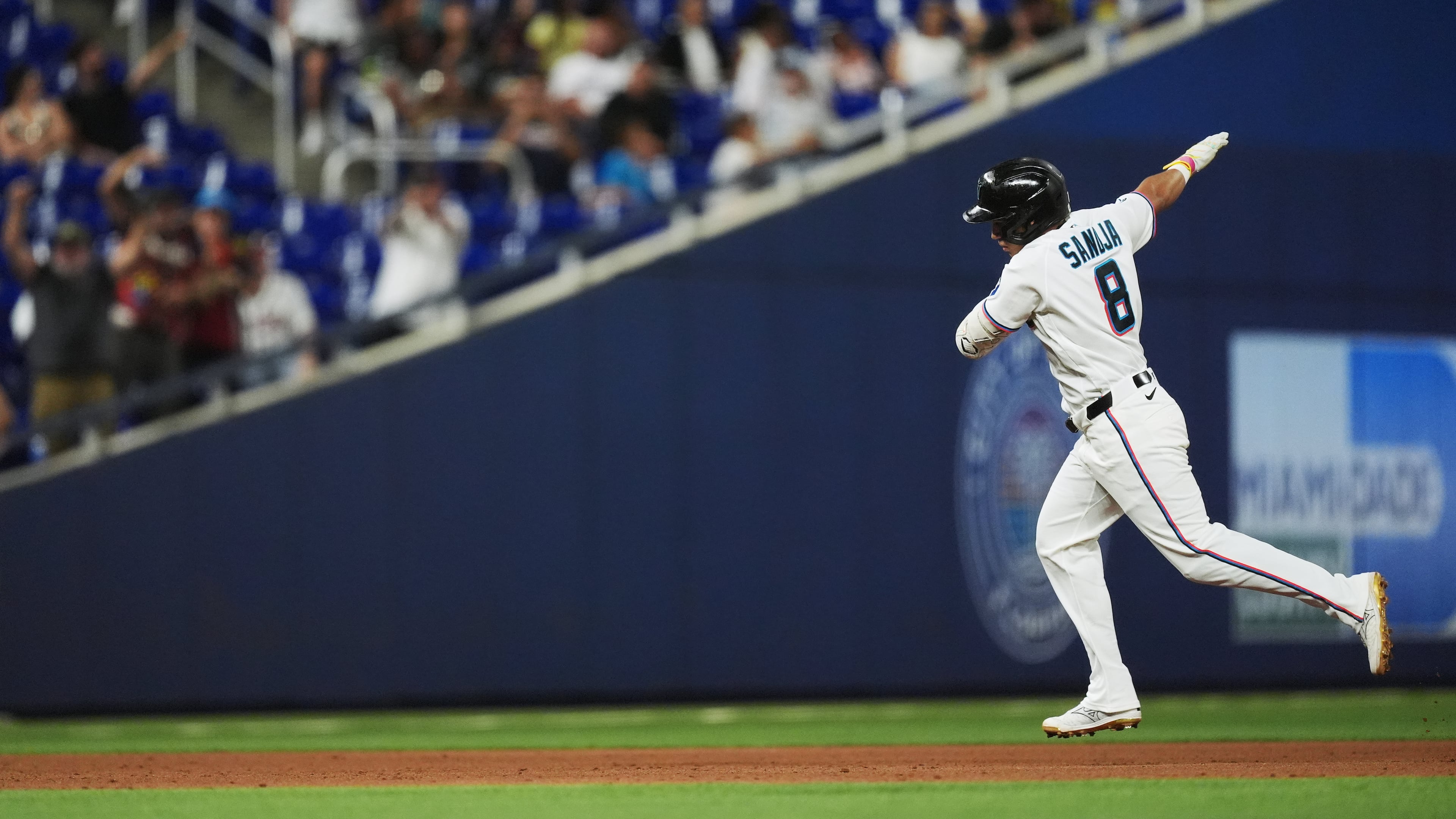 Miami Marlins' Javier Sanoja celebrates as he runs the bases after hitting a grand slam to bring home Jakob Marsee, Connor Norby, and Joe Mack, during the fifth inning of a baseball game against the Atlanta Braves, Monday, May 18, 2026, in Miami. (AP Photo/Rebecca Blackwell)
