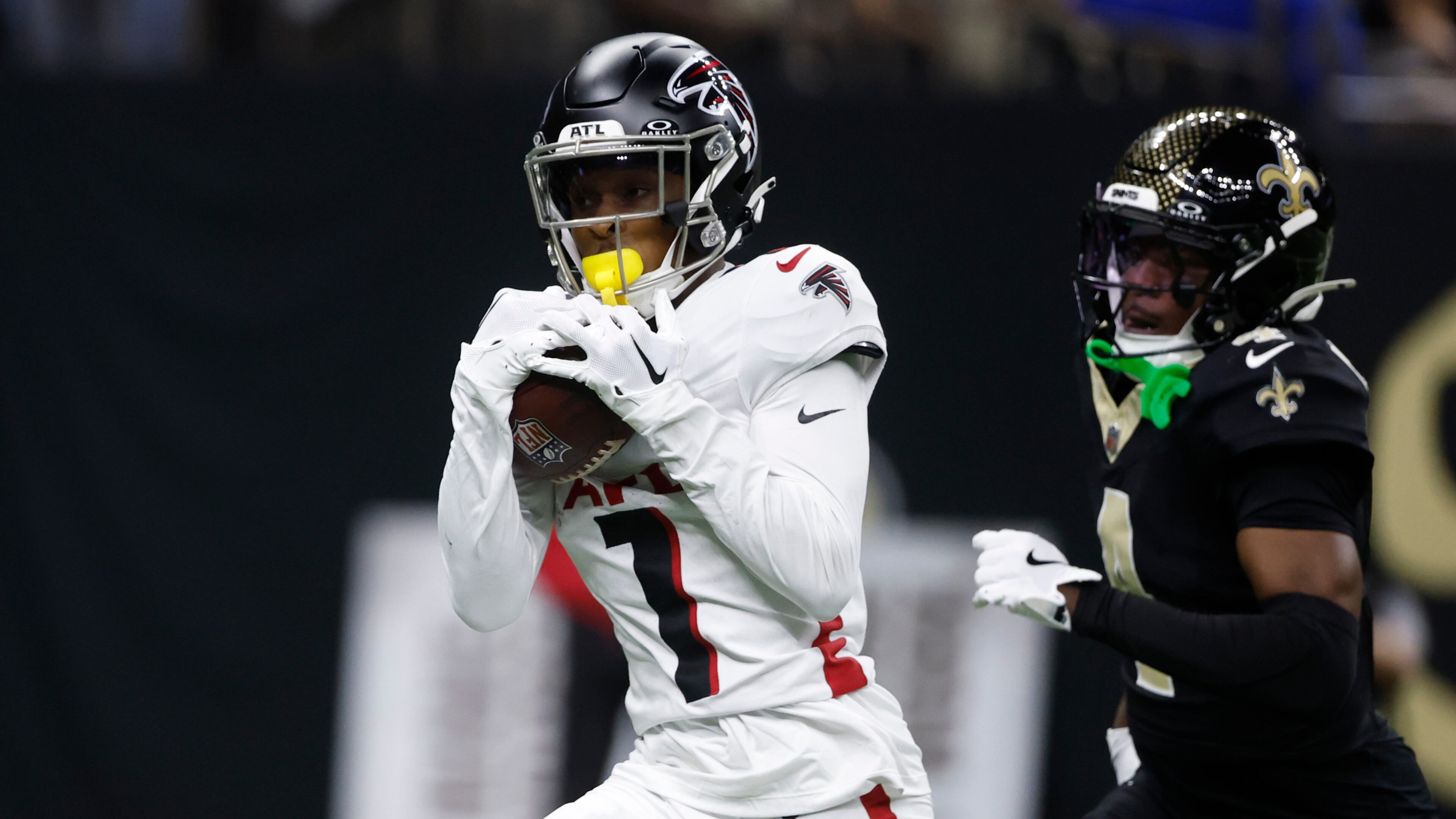 Atlanta Falcons wide receiver Darnell Mooney (1) catches a pass for a touchdown against New Orleans Saints cornerback Kool-Aid McKinstry, right, in the second half of an NFL football game, Sunday, Nov. 23, 2025, in New Orleans. (AP Photo/Butch Dill)