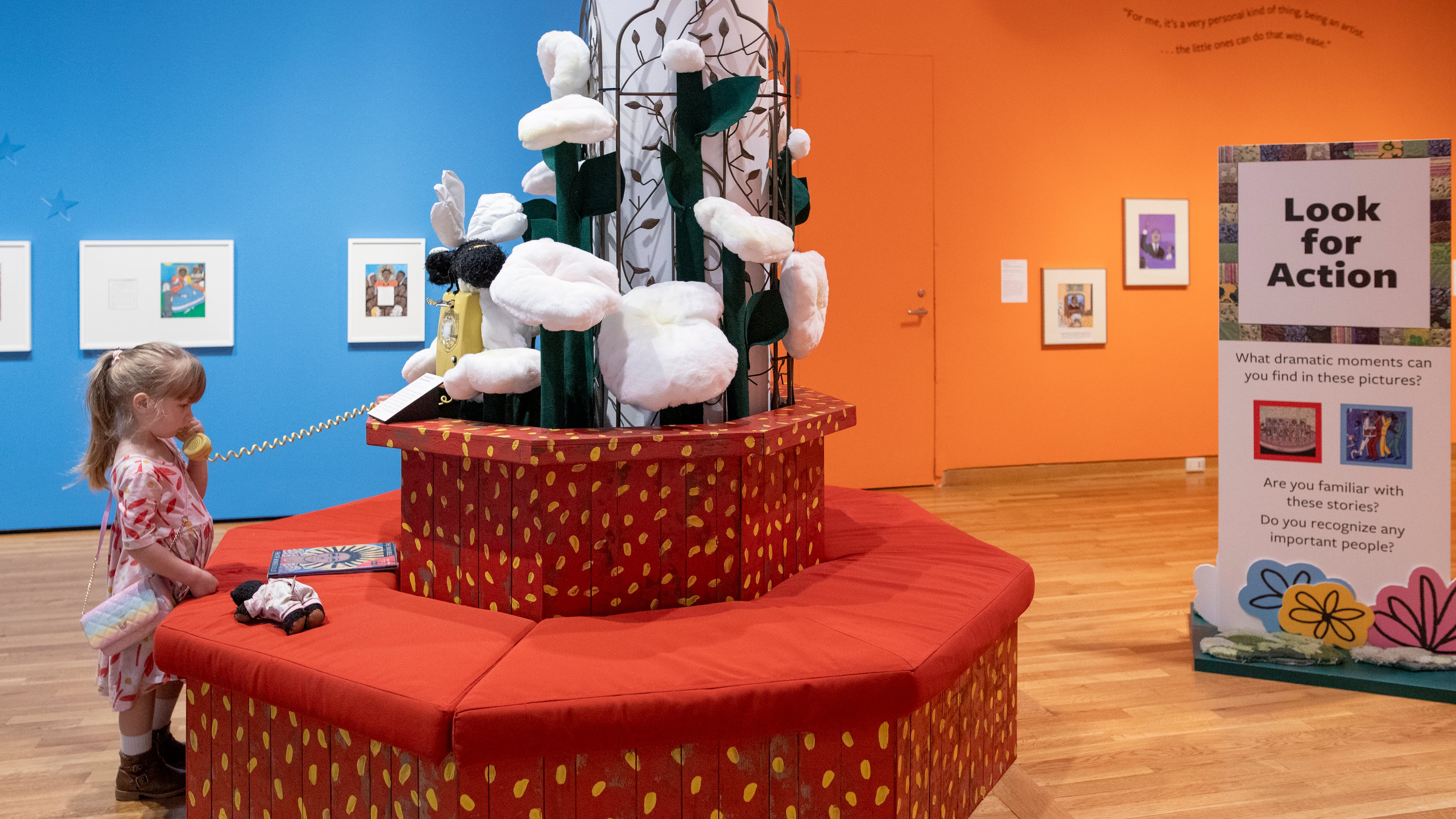 "Faith Ringgold: Seeing Children" features colorful paintings, illustrations and interactive soft sculptures. Old-school rotary phones play audio of children reading from featured books. (Courtesy of Isadora Pennington)