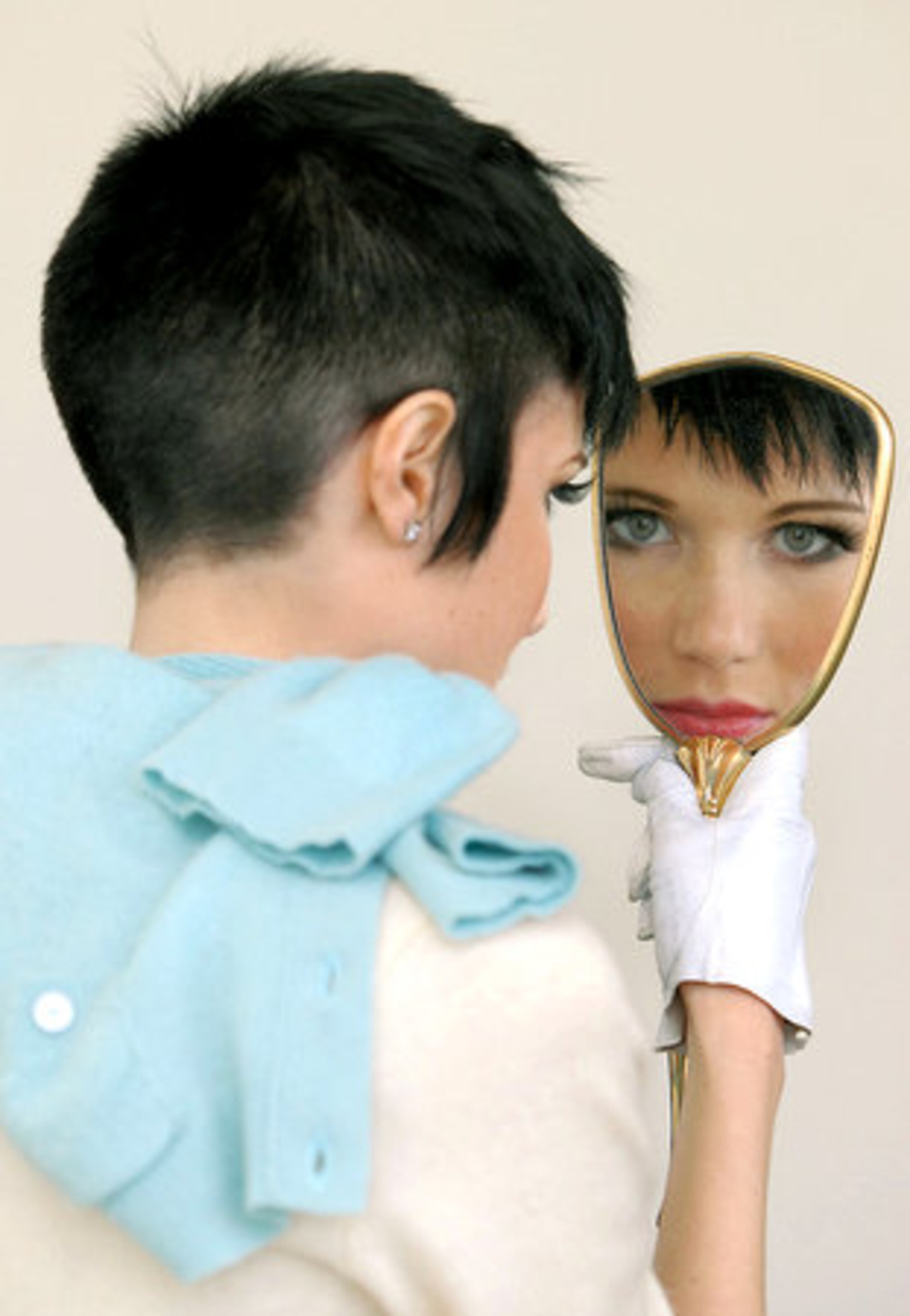 Anastasia looks at her hair done by stylist Tristin Morrison. Hair stylists from Aveda concept salons visited America's Mart in Atlanta on March 16 and 17 for a Jam session.