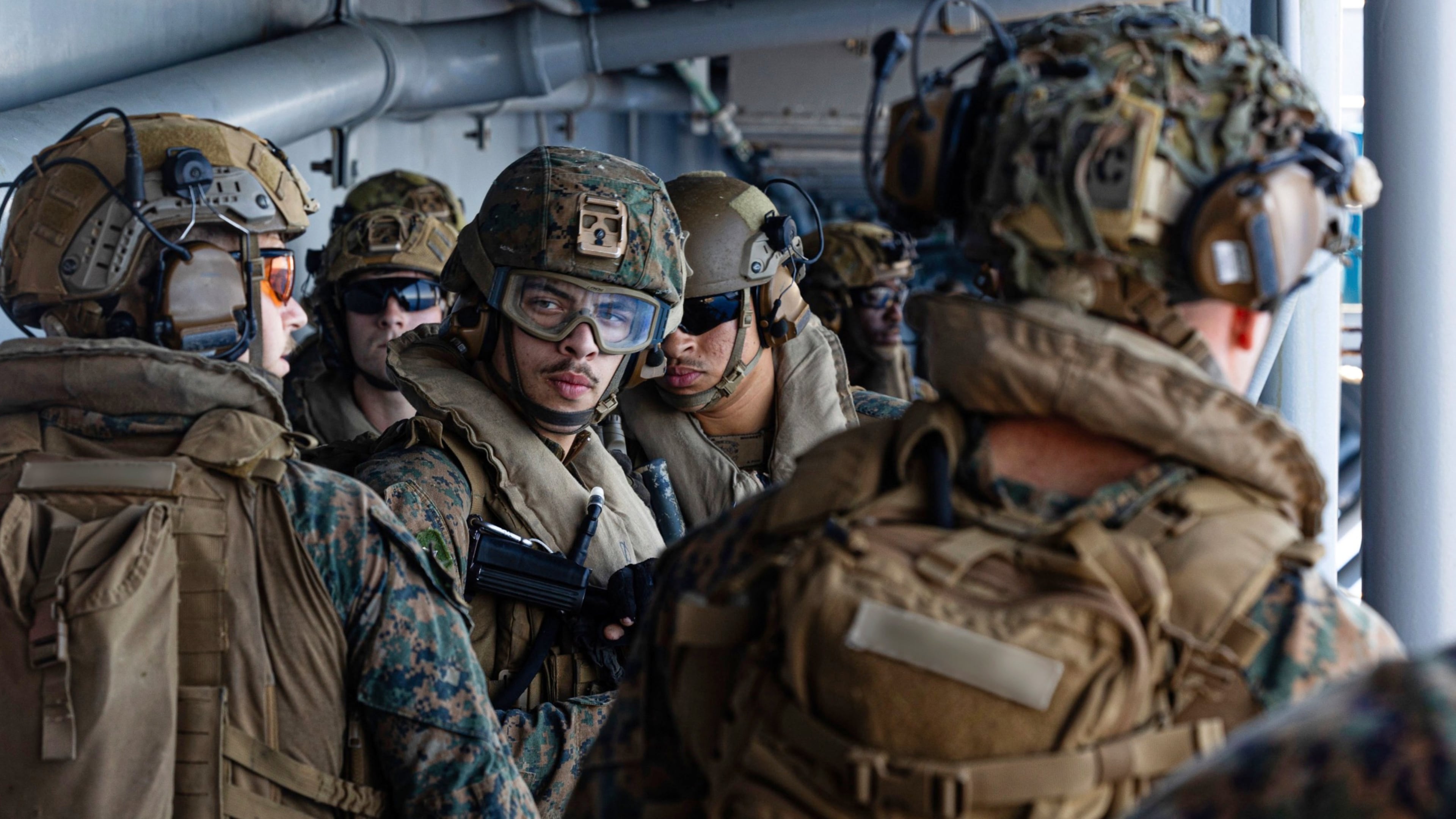 This image from video provided by U.S. Central Command shows U.S. Sailors and Marines aboard USS Tripoli (LHA 7) arriving in the U.S. Central Command area of responsibility, March 27, 2026. (U.S. Central Command via AP)