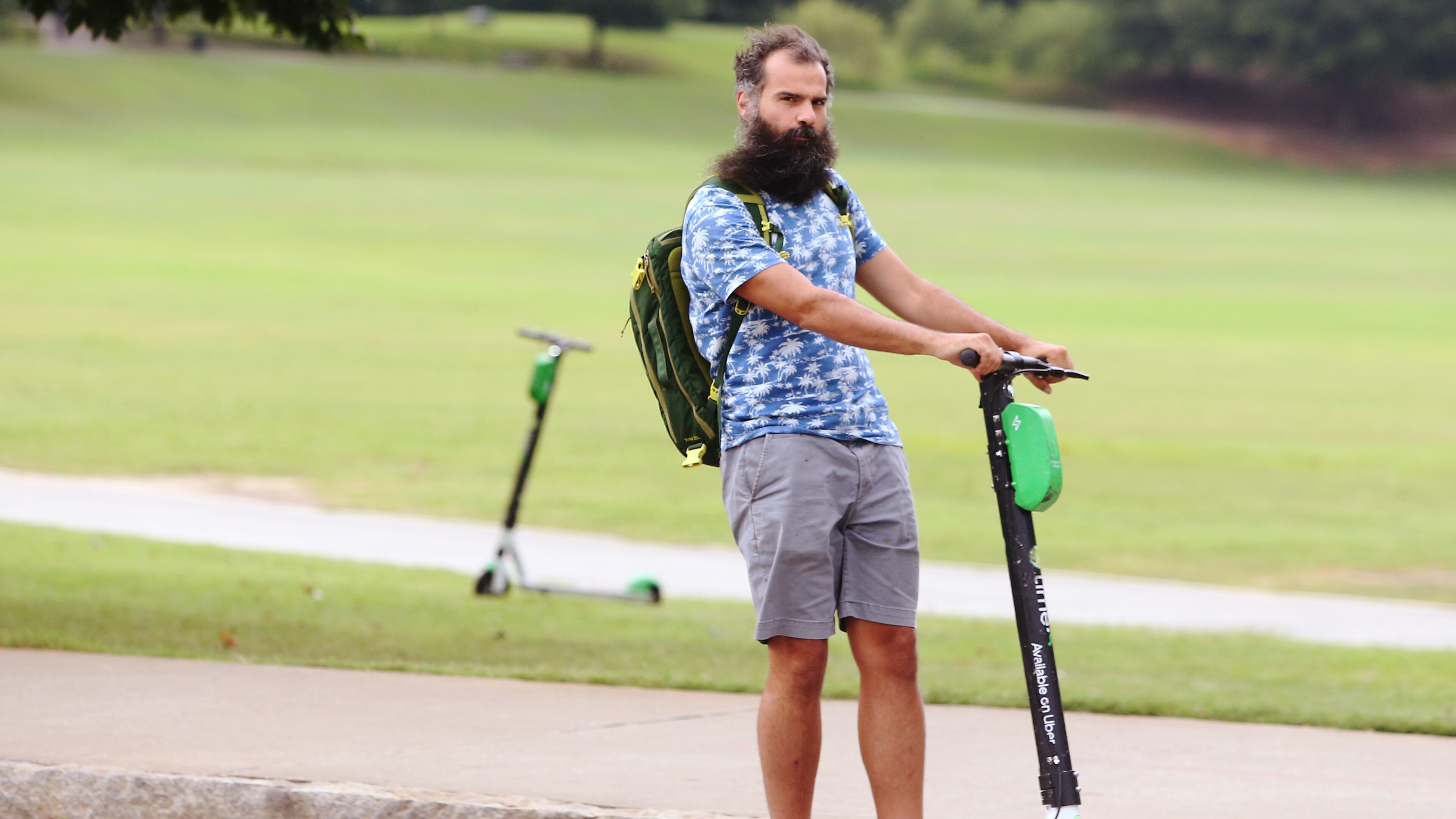 July 18, 2019 Atlanta- A man rides a scooter by Piedmont Park in Atlanta on Wednesday, July 18, 2019. Many Atlantans have embraced e-scooters, while others complain that they violate pedestrians' right of way. Atlanta City Council approved regulations on the scooters at the beginning of 2019, requiring companies to prevent them from being scattered haphazardly on city sidewalks. Christina Matacotta/Christina.Matacotta@ajc.com