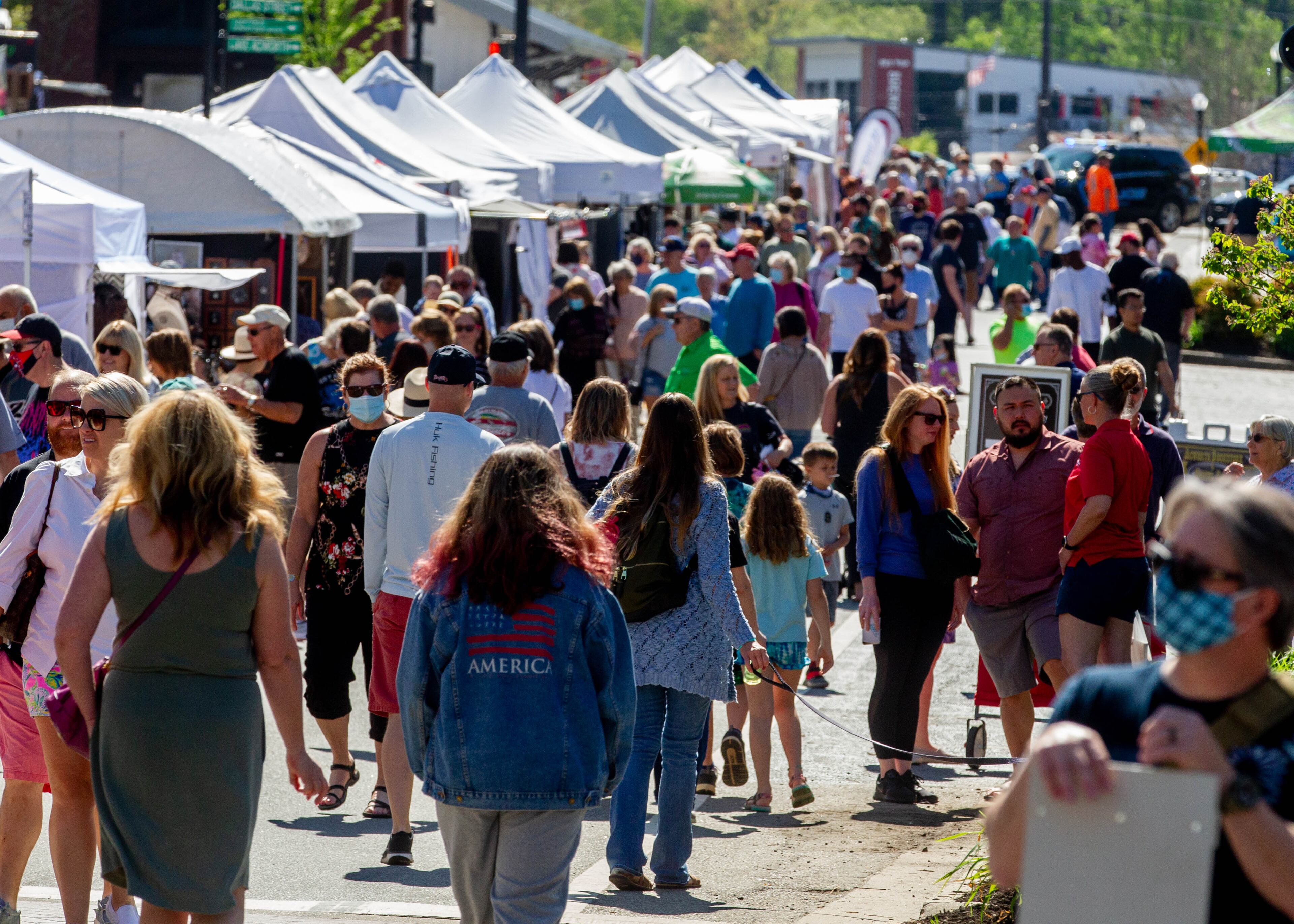 People walk around the artists' booths at the Acworth Art Fest on Sunday, April 11, 2021. (Photo: Steve Schaefer for The Atlanta Journal-Constitution)