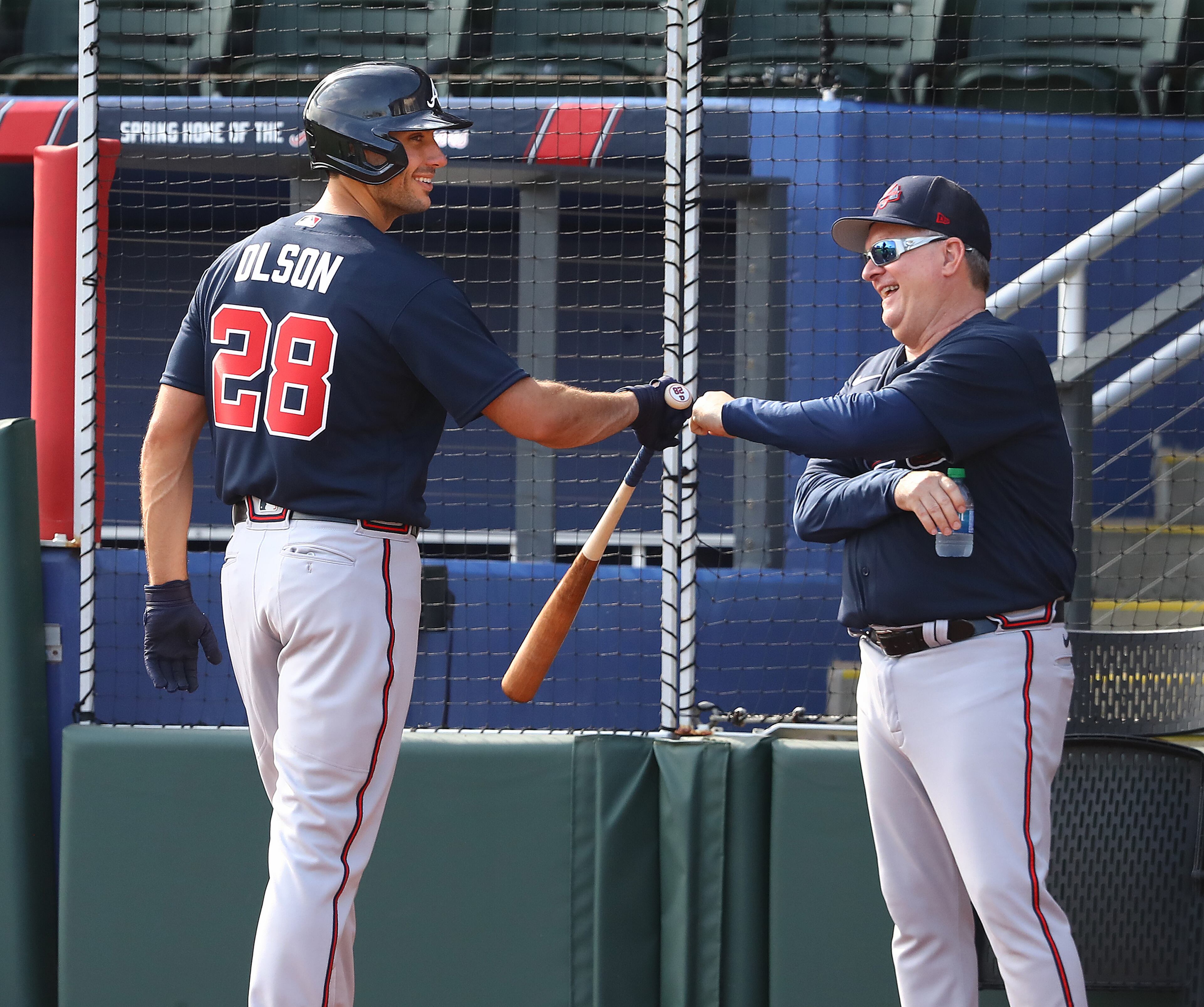 031622 North Port: Atlanta Braves newly signed first baseman Matt Olson gets a fist bump from hitting coach Kevin Seitzer after ripping a single off pitcher Charlie Morton during his first plate appearance with the team during live batting practice at Spring Training at CoolToday Park on Wednesday, March 16, 2022, in North Port. “Curtis Compton / Curtis.Compton@ajc.com”