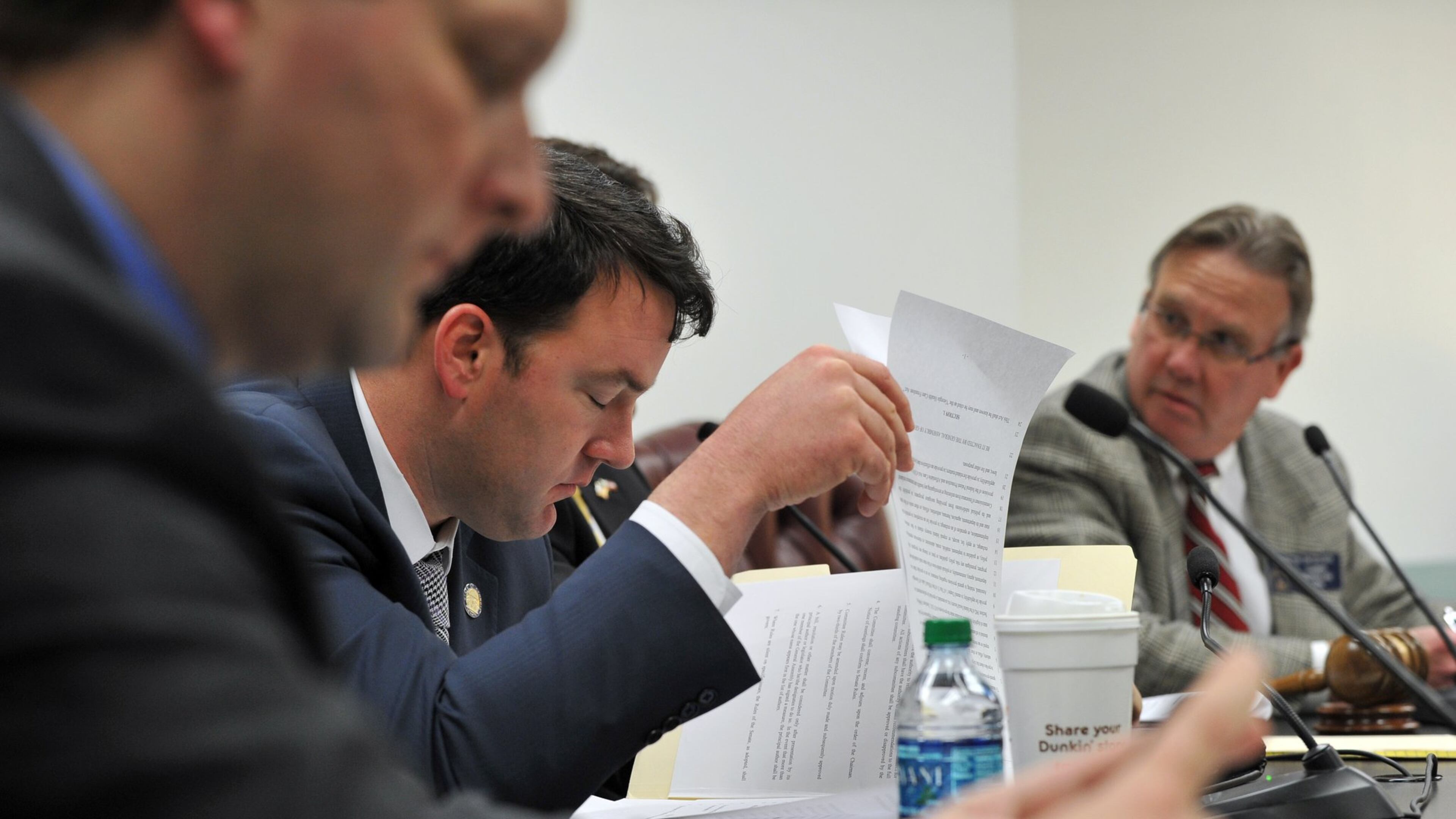 Sen. Burt Jones looks over HB 707, the Georgia Health Care Freedom Act during a committee meeting Thursday March 13, 2014. The bill passed committee and now goes to the senate for voting. BRANT SANDERLIN /BSANDERLIN@AJC.COM