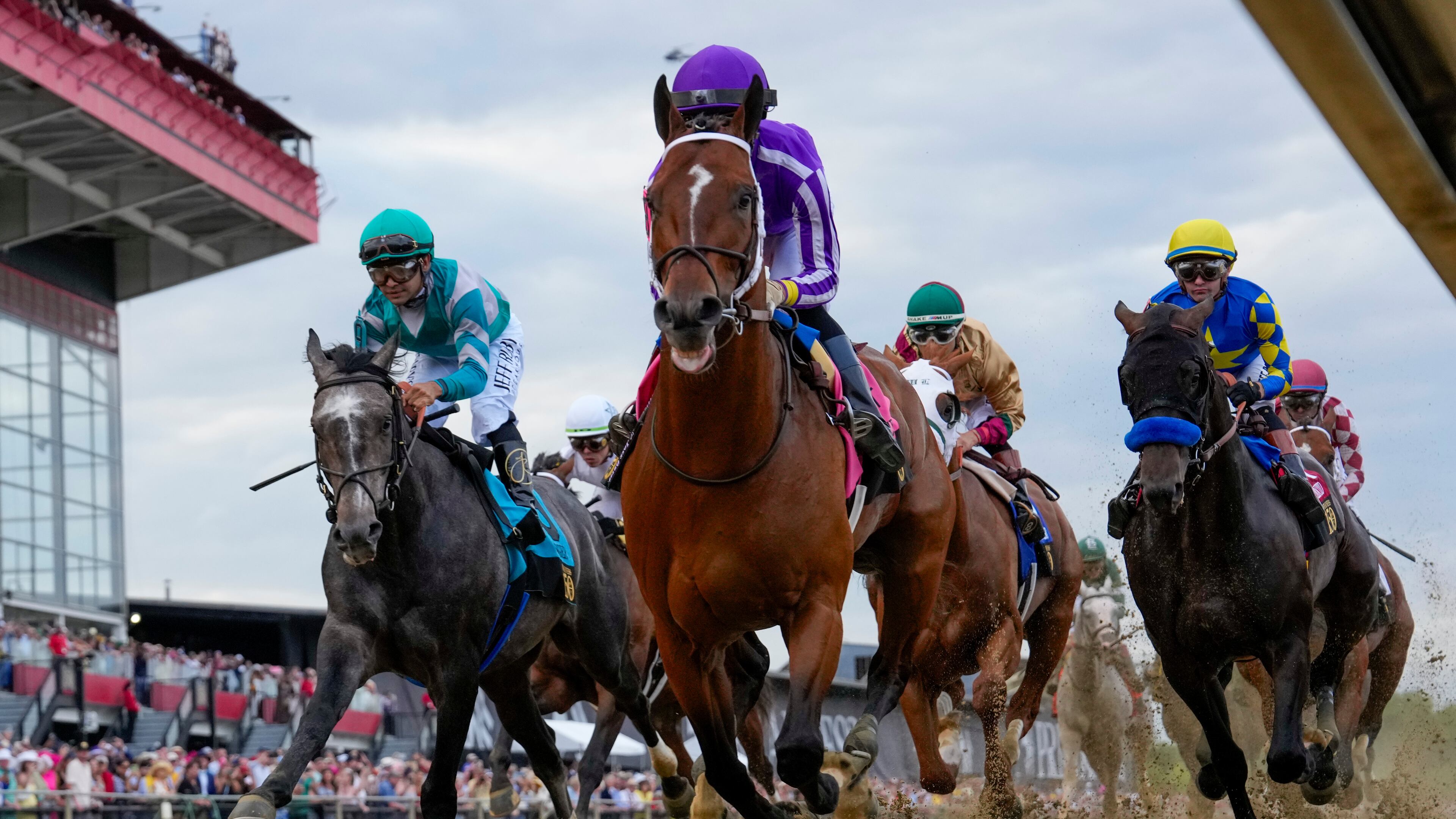 FILE - Jockeys compete during the 150th running of the Preakness Stakes horse race on May 17, 2025, at Pimlico Race Course in Baltimore. (AP Photo/Stephanie Scarbrough, File)