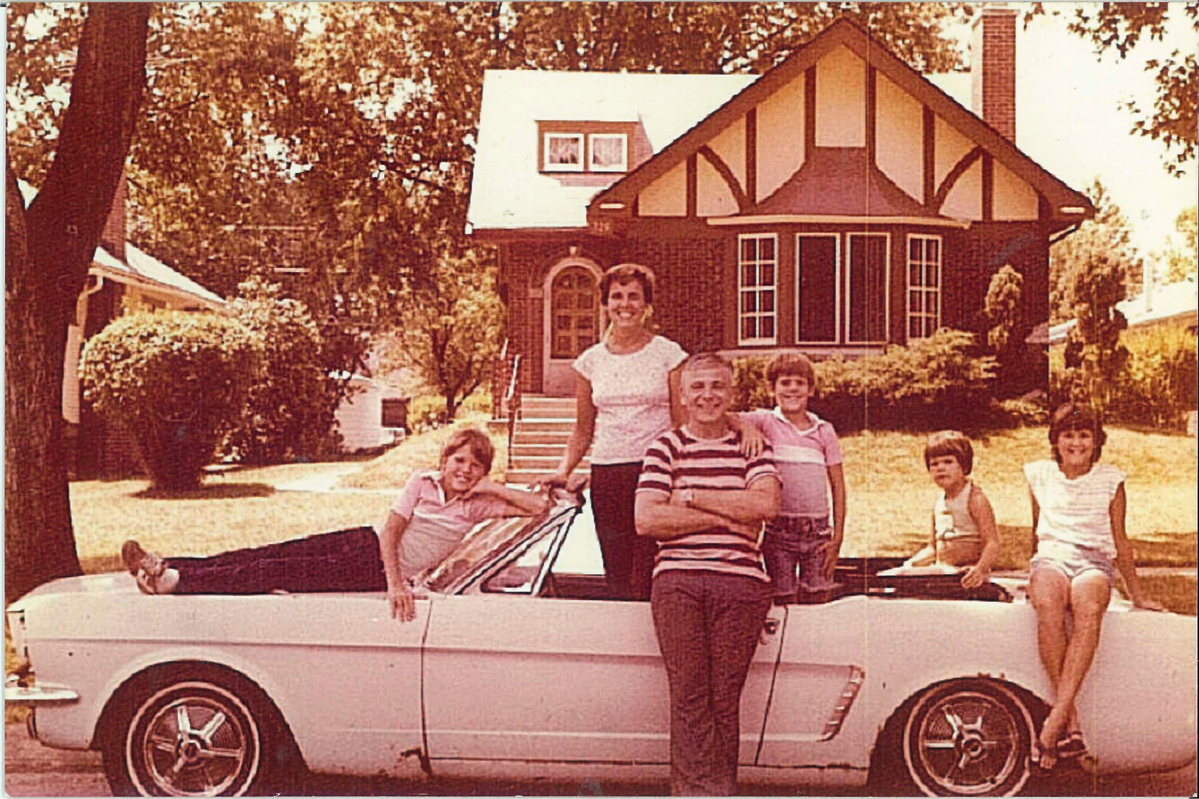 Gail and Tom Wise pose outside their home with their children (from left) Michael, Tim, Laura and Sally on their Skylight Blue 1964 1/2 Ford Mustang convertible in Park Ridge, Illinois in July 1979. Gail Wise, then using her maiden name of Gail Brown, made the first known retail purchase of a Mustang on April 15, 1964, two days before the model went on sale. The car was garaged shortly after the photo was taken, until its restoration by Tom Wise 27 years later. Picture taken July 1979. REUTERS/Courtesy of Tom and Gail Wise/Handout via Reuters