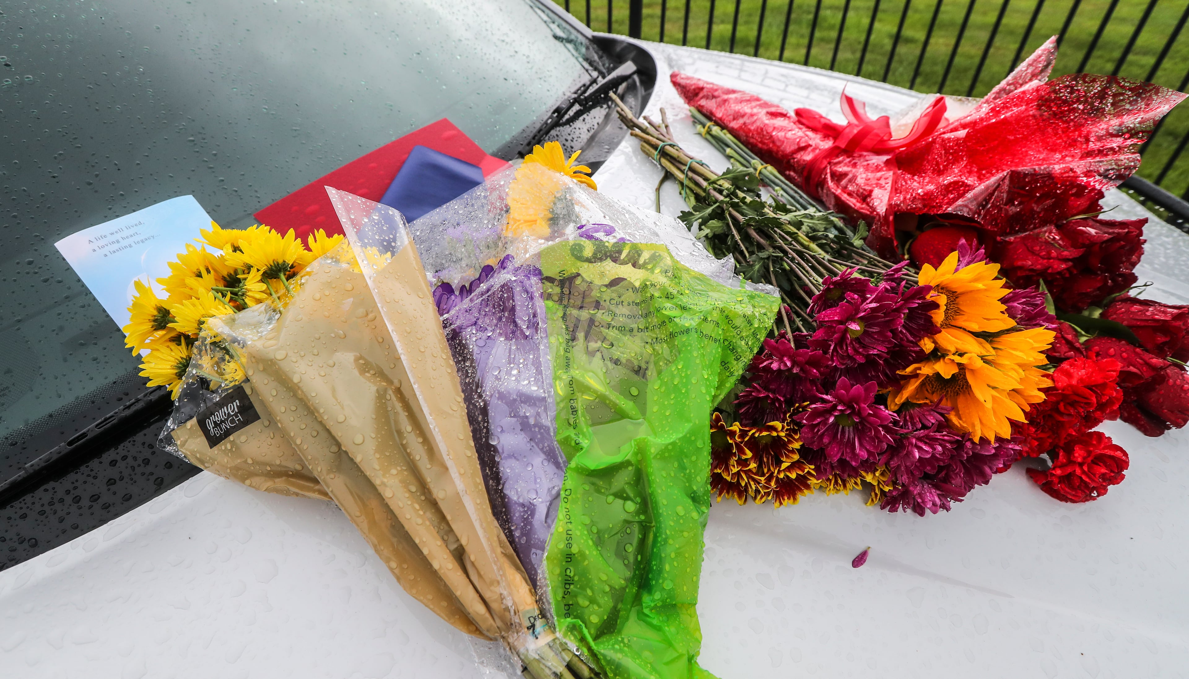 September 12, 2022 Atlanta: A memorial of two patrol cars was parked with flowers and notes served as a reminder of the tragedy last week of two Cobb County deputies killed in the line of duty. (John Spink / John.Spink@ajc.com)