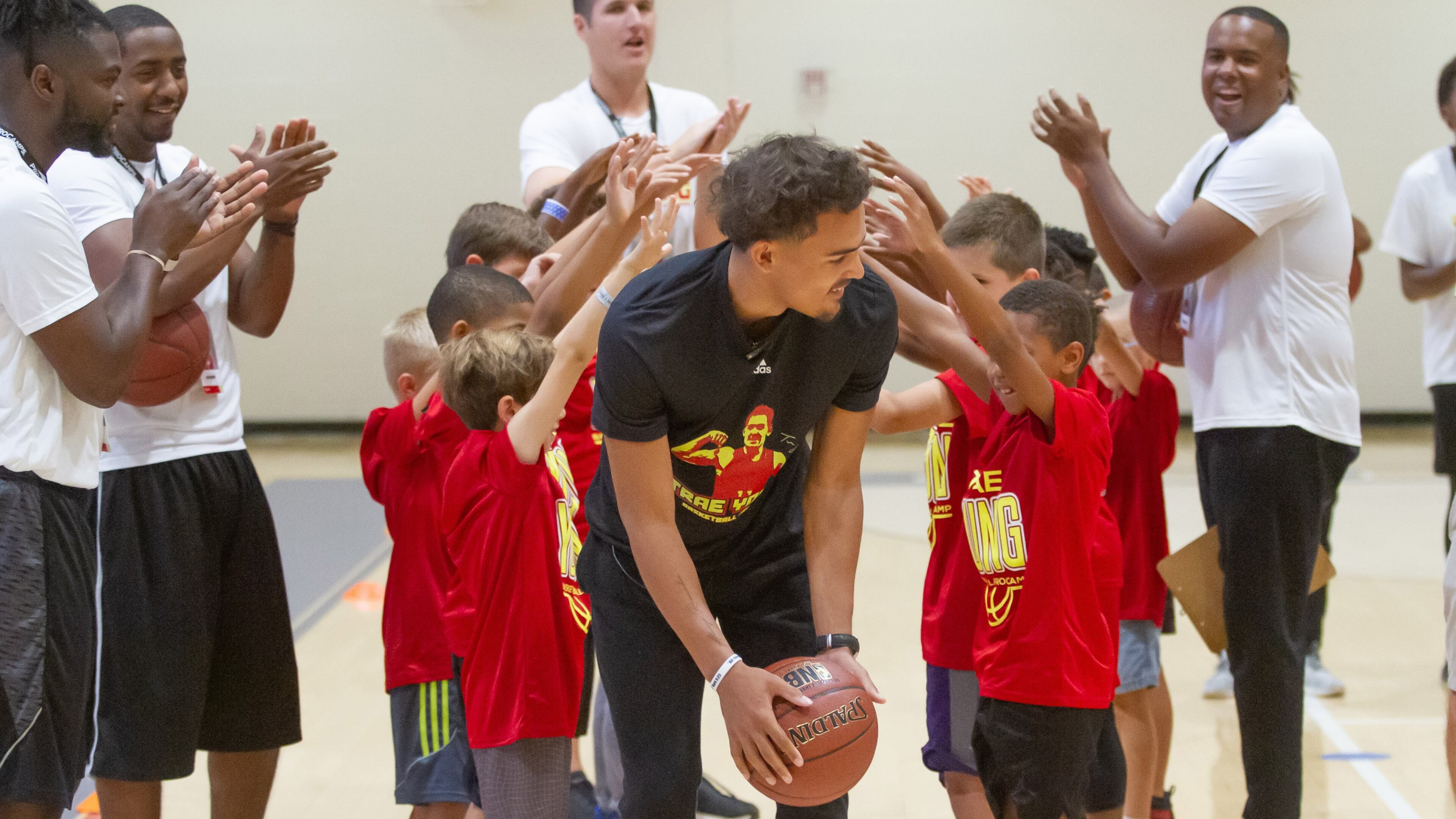 Atlanta Hawks Guard Trae Young gets introduced at the start of a youth camp at Norcross High School Saturday, July 27, 2019. STEVE SCHAEFER / SPECIAL TO THE AJC
