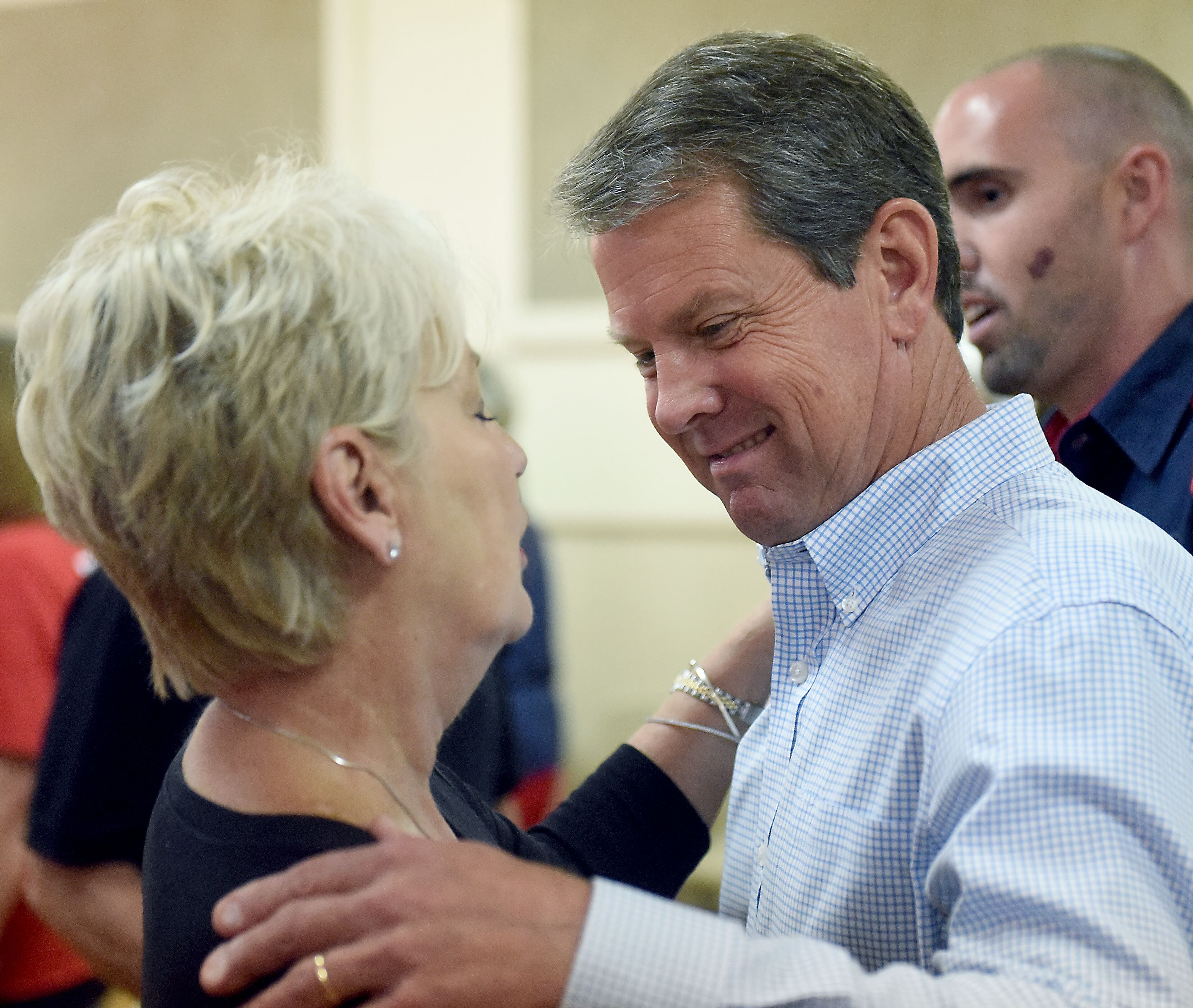 October 4, 2018 Ocilla - GOP candidate for governor Brian Kemp (right) takes in praises from a supporter at the Ocilla Community House, Thursday, October 4, 2018. (RYON HORNE / RHORNE@AJC.COM)