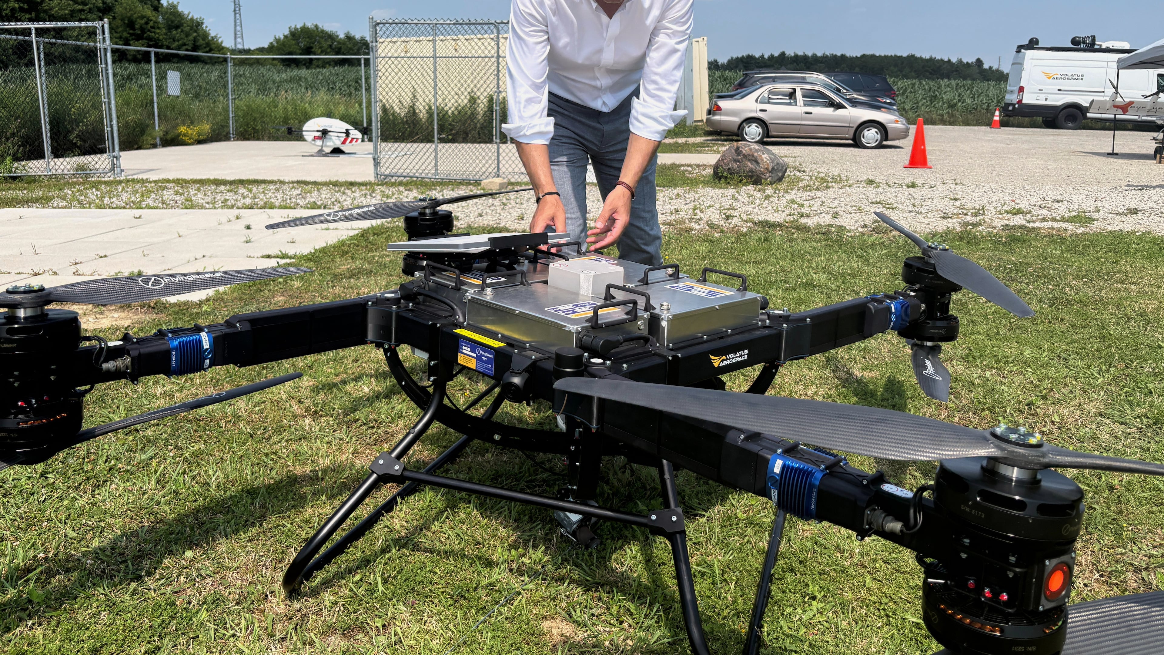Volatus Aerospace COO Greg Colacitti inspects a heavy lift drone before a test run on July 13, 2026, in Kleinburg, Ontario. (AP Photo/Kelvin Chan)
