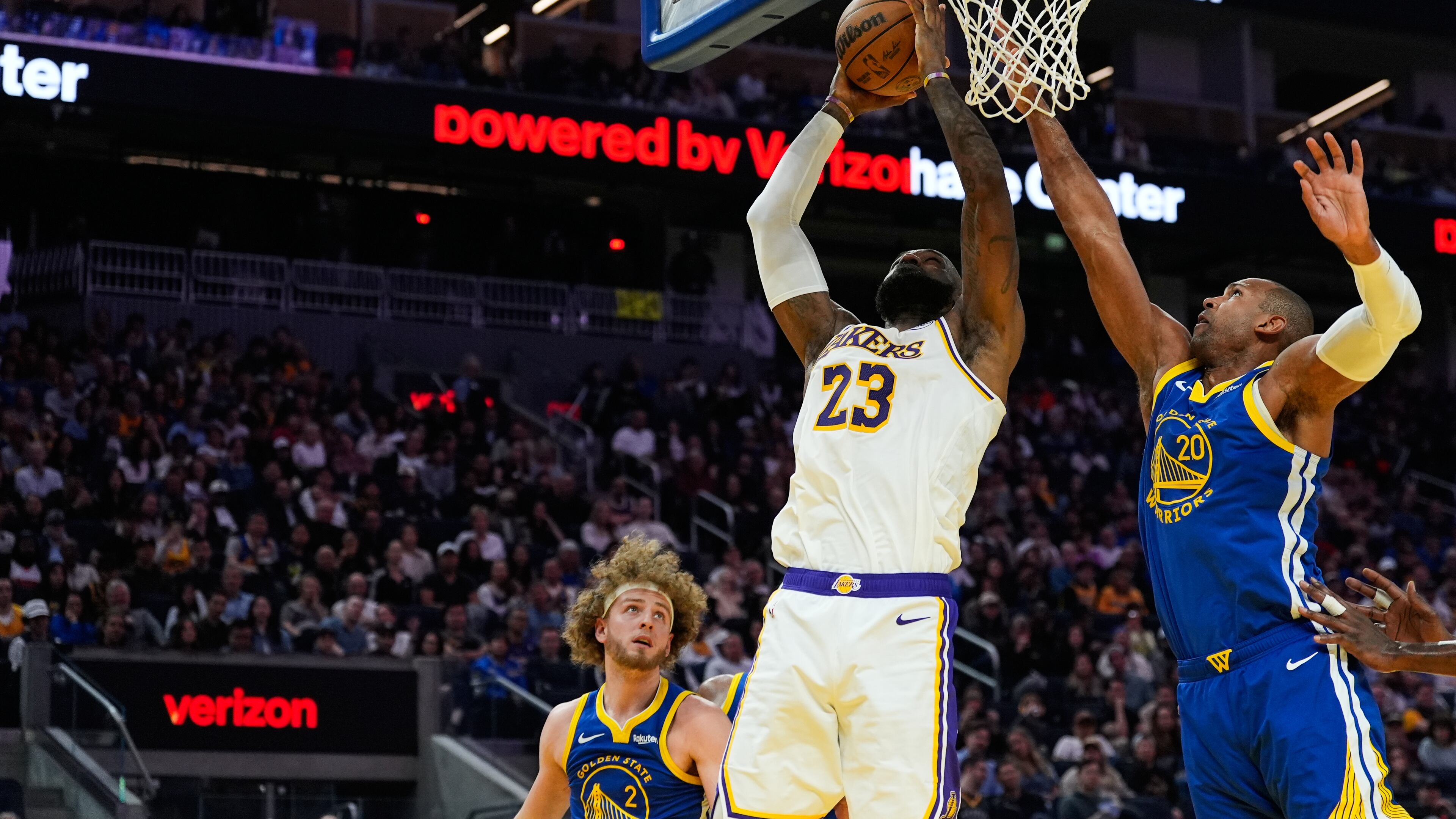 Los Angeles Lakers forward LeBron James (23) shoots while defended by Golden State Warriors center Al Horford (20) during the first half of an NBA basketball game, Saturday, Feb. 28, 2026, in San Francisco. (AP Photo/Godofredo A. Vásquez)