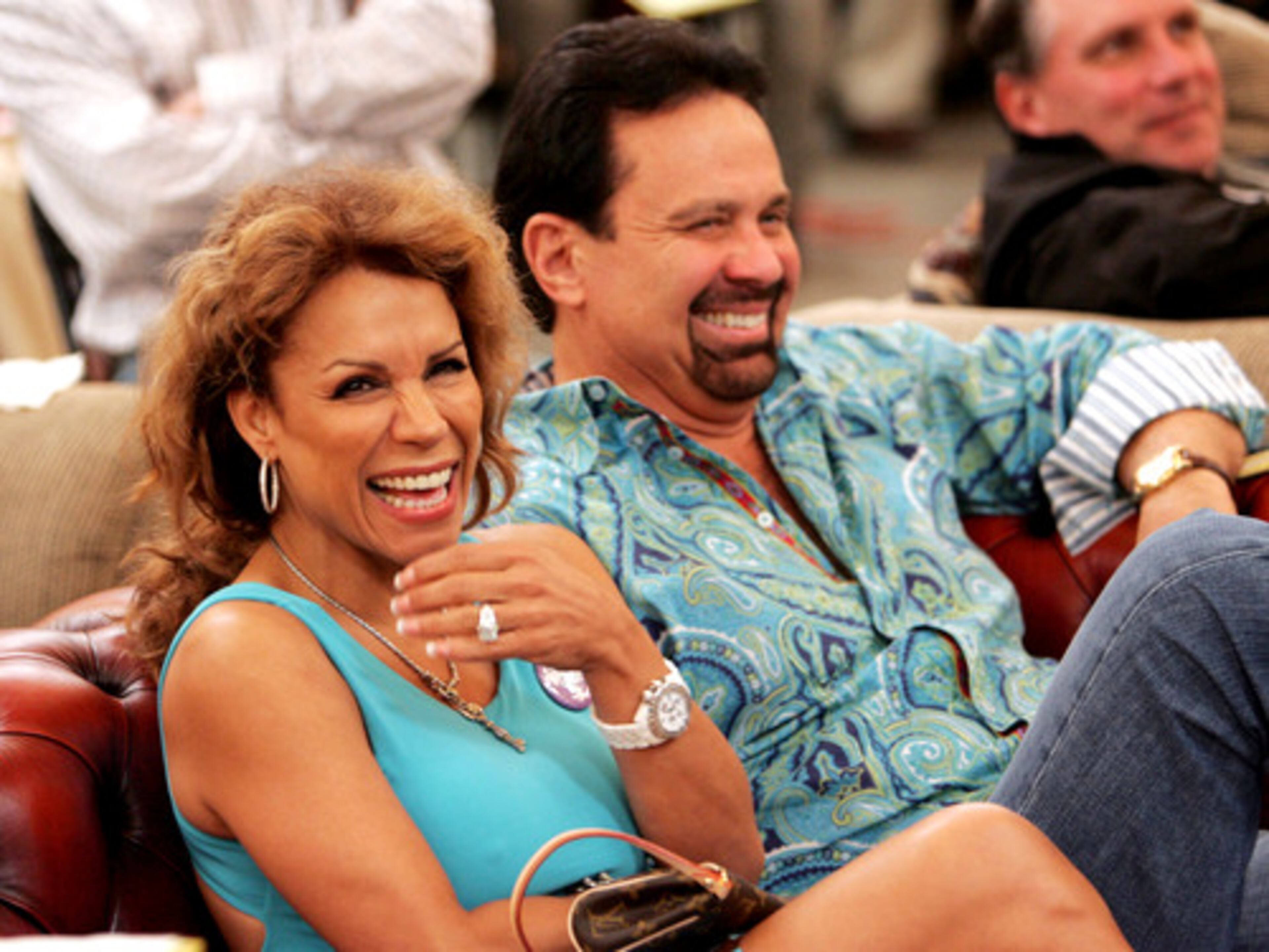 Bianca Diaz and Robert Patek laugh at an auctioneer's attempt to get them to raise their bid.