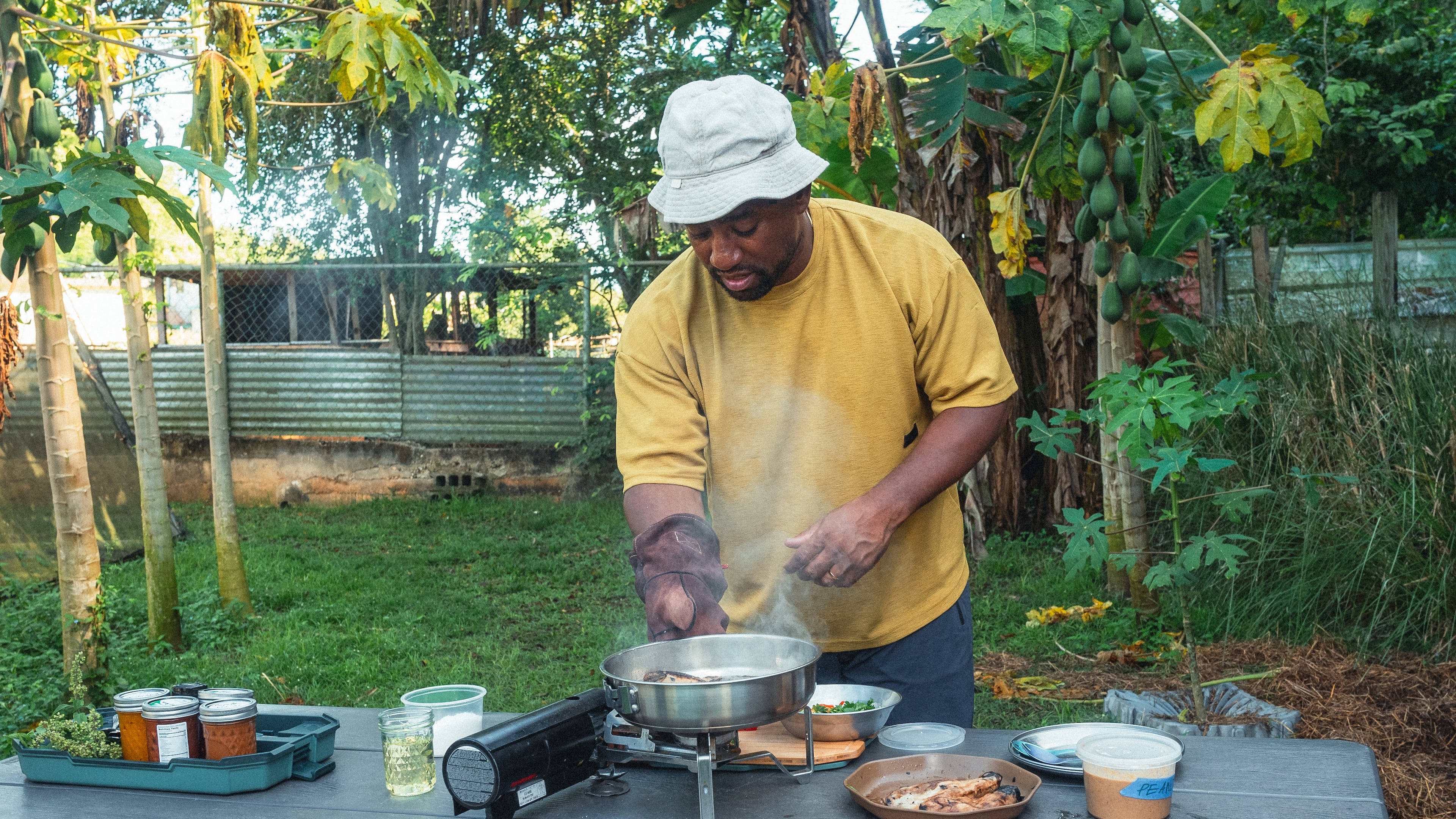 Rashad Frazier prepares food outdoors in Lava Lands, Ore., on Aug. 7, 2024. (Alex Forestier via AP)