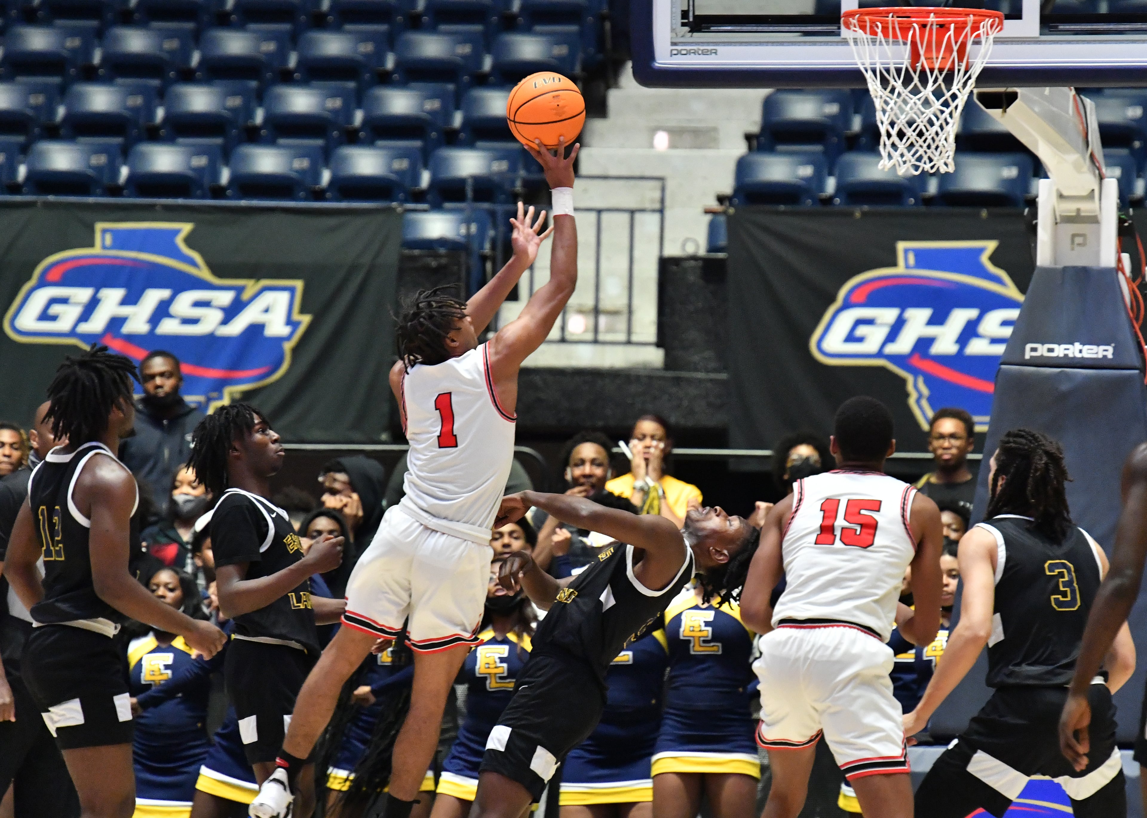 Tri-Cities' Noricco Danner (1) shoots over Eagle's Landing's AJ Barnes (5) during the 2022 GHSA State Basketball Class AAAAA Boys Championship game at the Macon Centreplex in Macon on Thursday, March 10, 2022. (Hyosub Shin / Hyosub.Shin@ajc.com)
