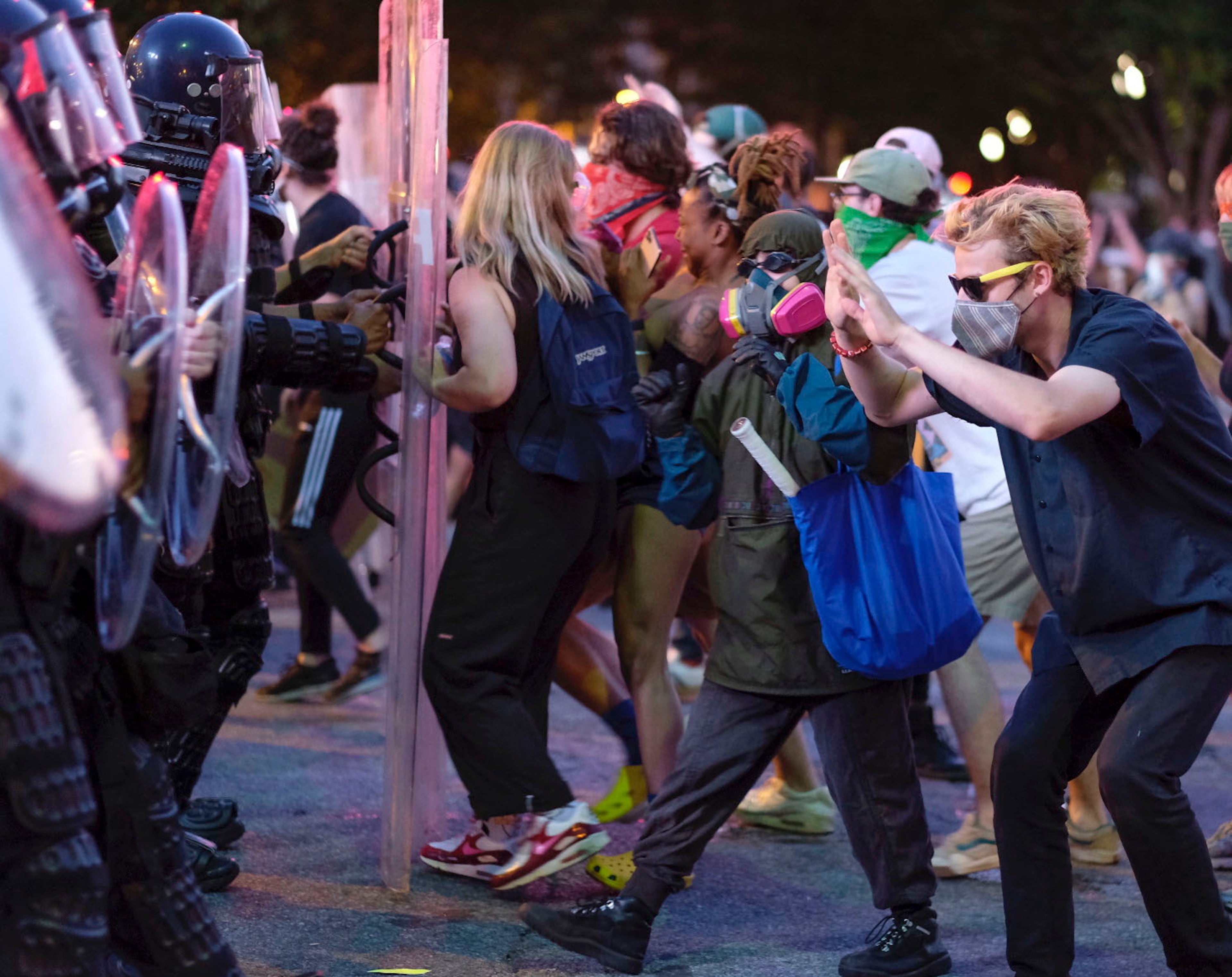 June 2, 2020 - Atlanta - Protestors dodge tear gas and police after the 9pm curfew in downtown Atlanta as protests continued for a fourth day. Protests over the death of George Floyd in Minneapolis police custody continued around the United States, as his case renewed anger about others involving African Americans, police and race relations. Ben Gray for the Atlanta Journal Constitution